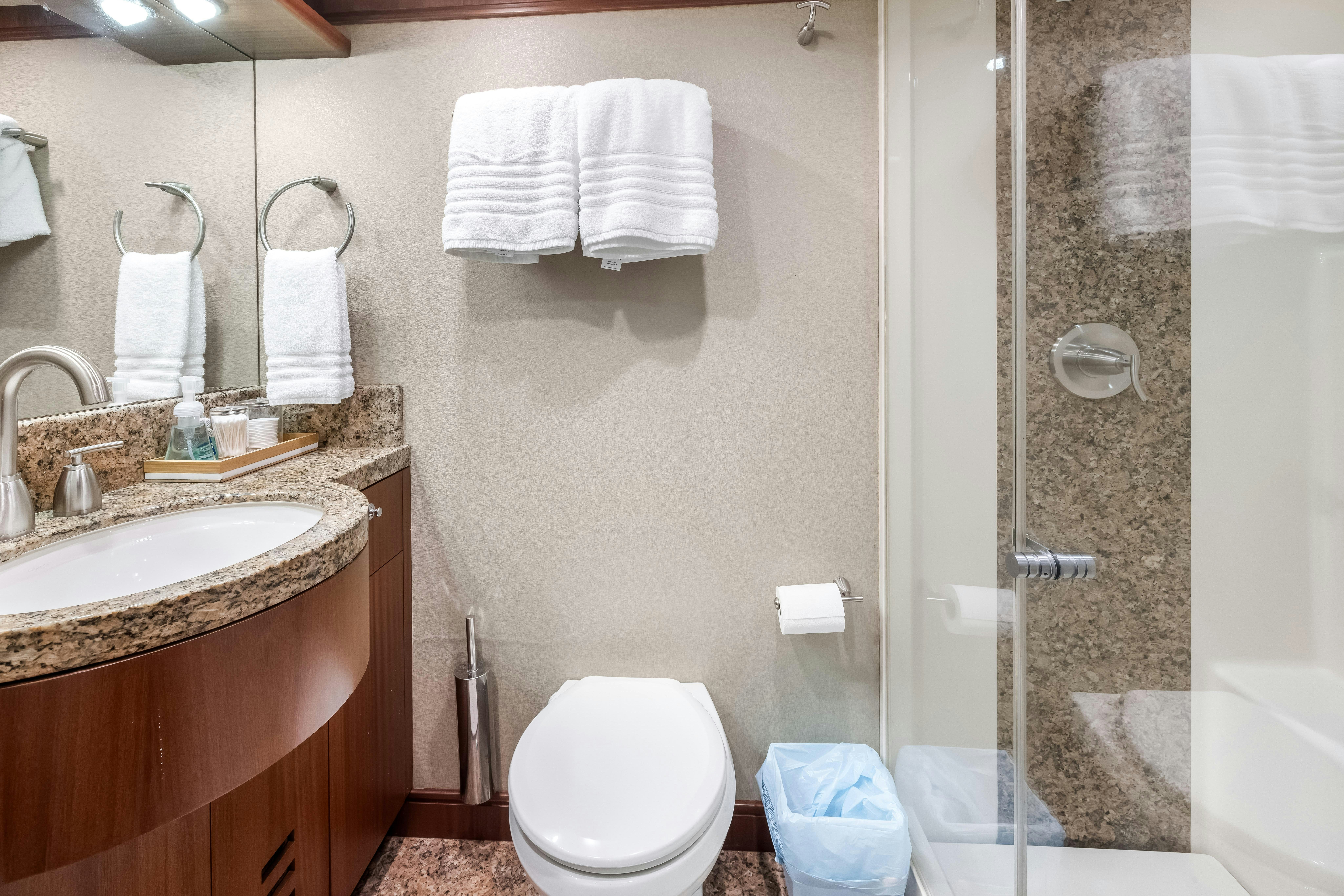 a bathroom with a sink and a toilet aboard AURORA Yacht for Sale