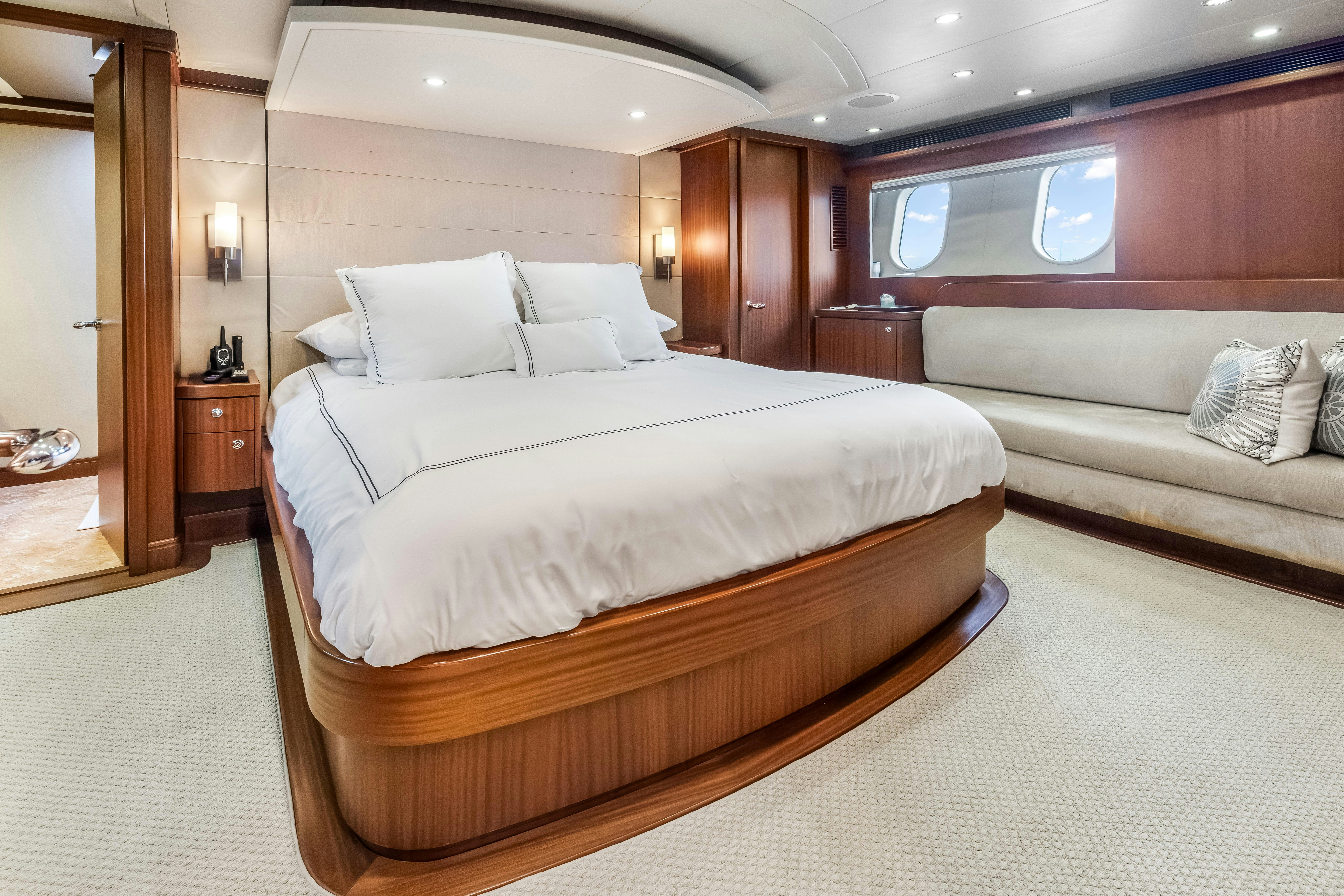 a bed in a room aboard AURORA Yacht for Sale