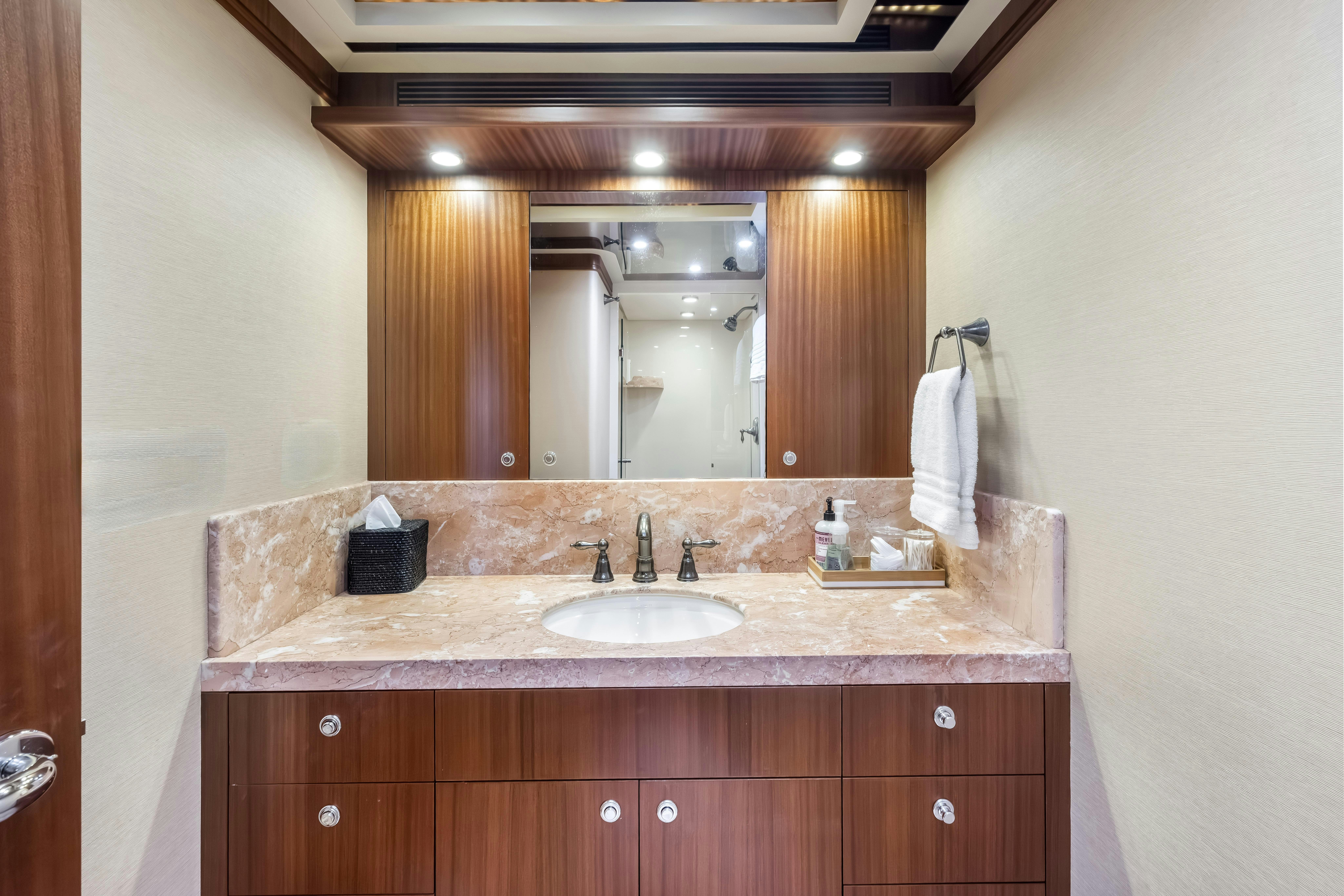 a bathroom with a large mirror aboard AURORA Yacht for Sale