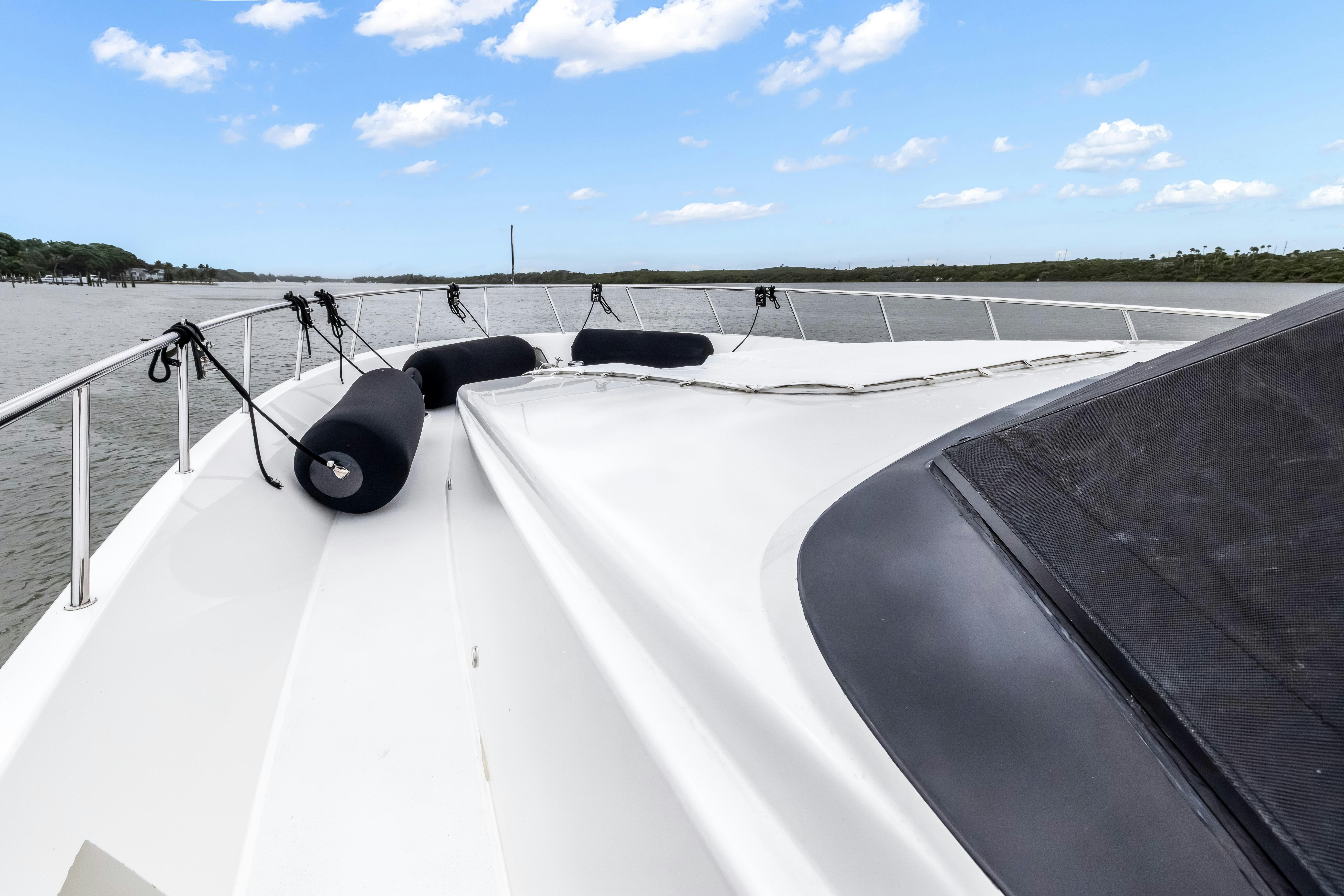 a white car on a road aboard AURORA Yacht for Sale