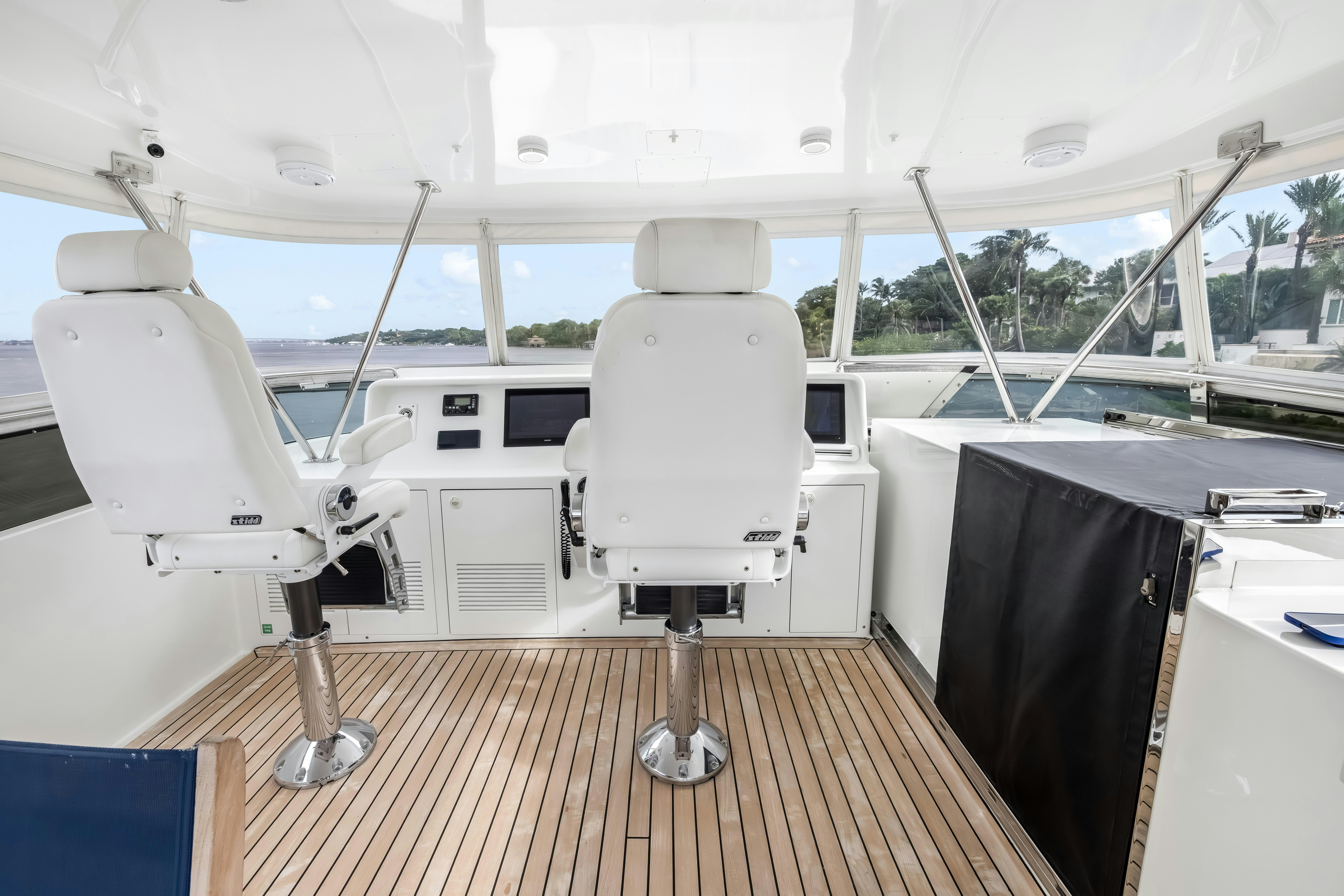 a white boat on a deck aboard AURORA Yacht for Sale