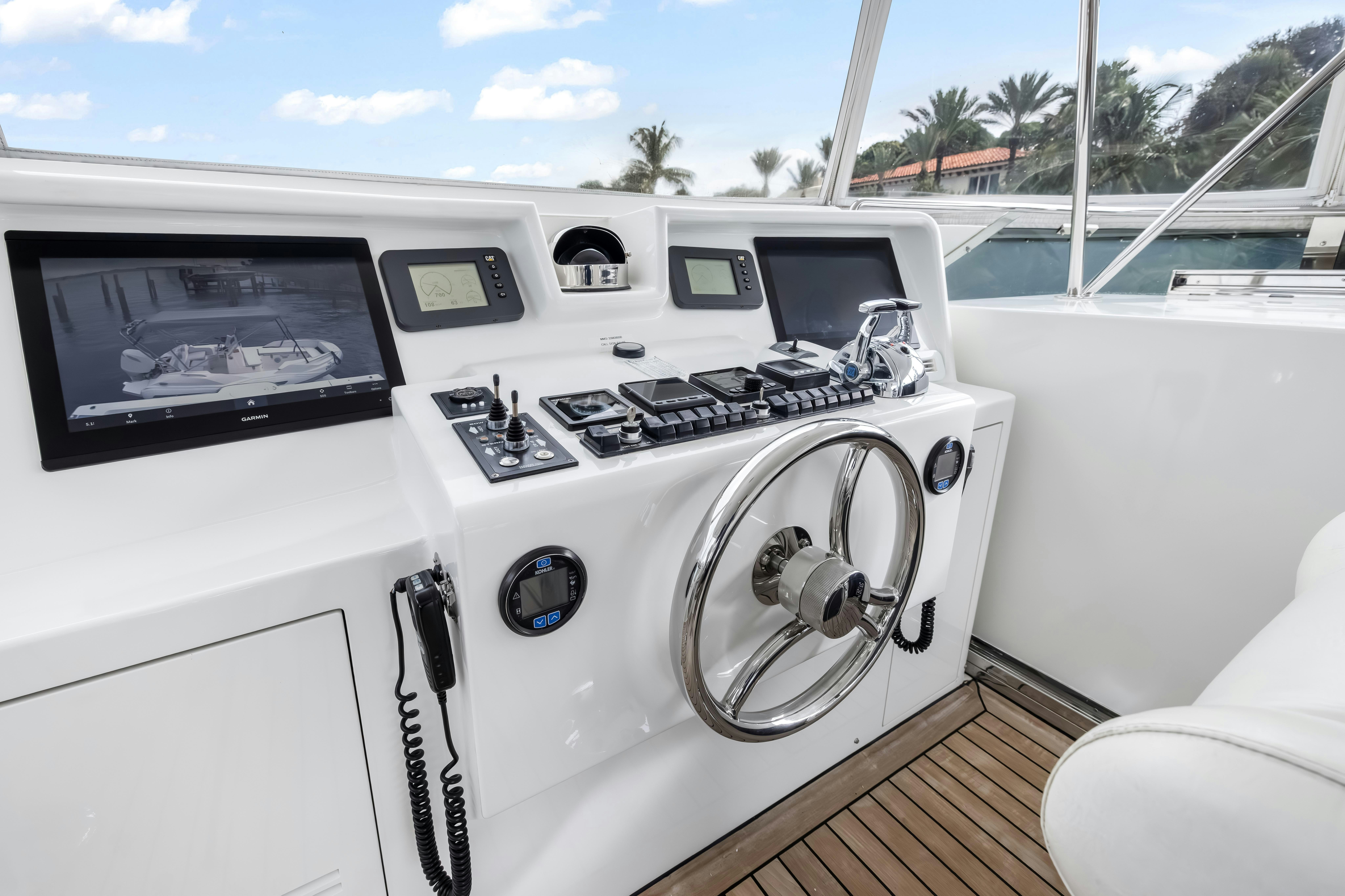 a white car with a black wheel aboard AURORA Yacht for Sale