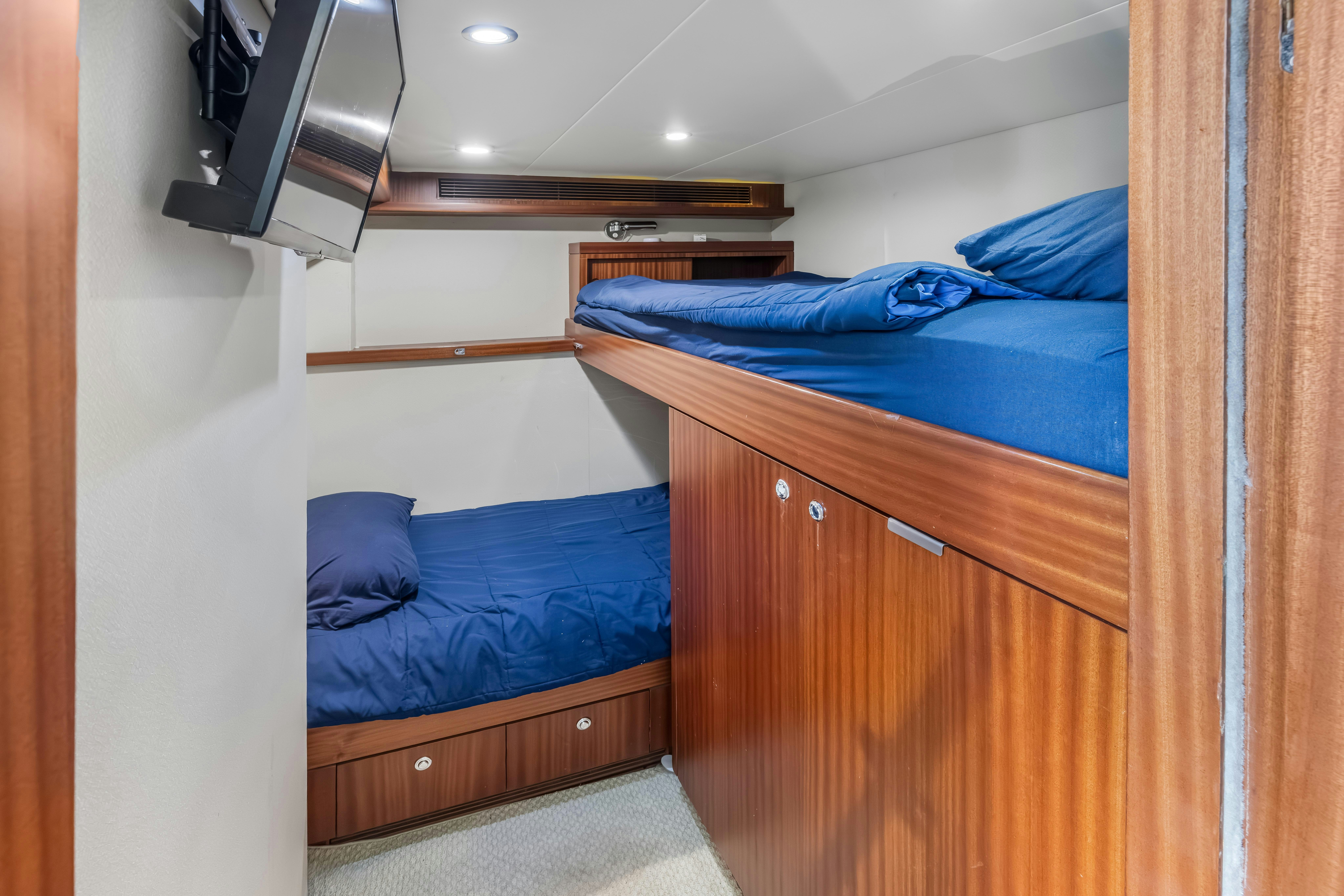 a couple of beds in a room aboard AURORA Yacht for Sale