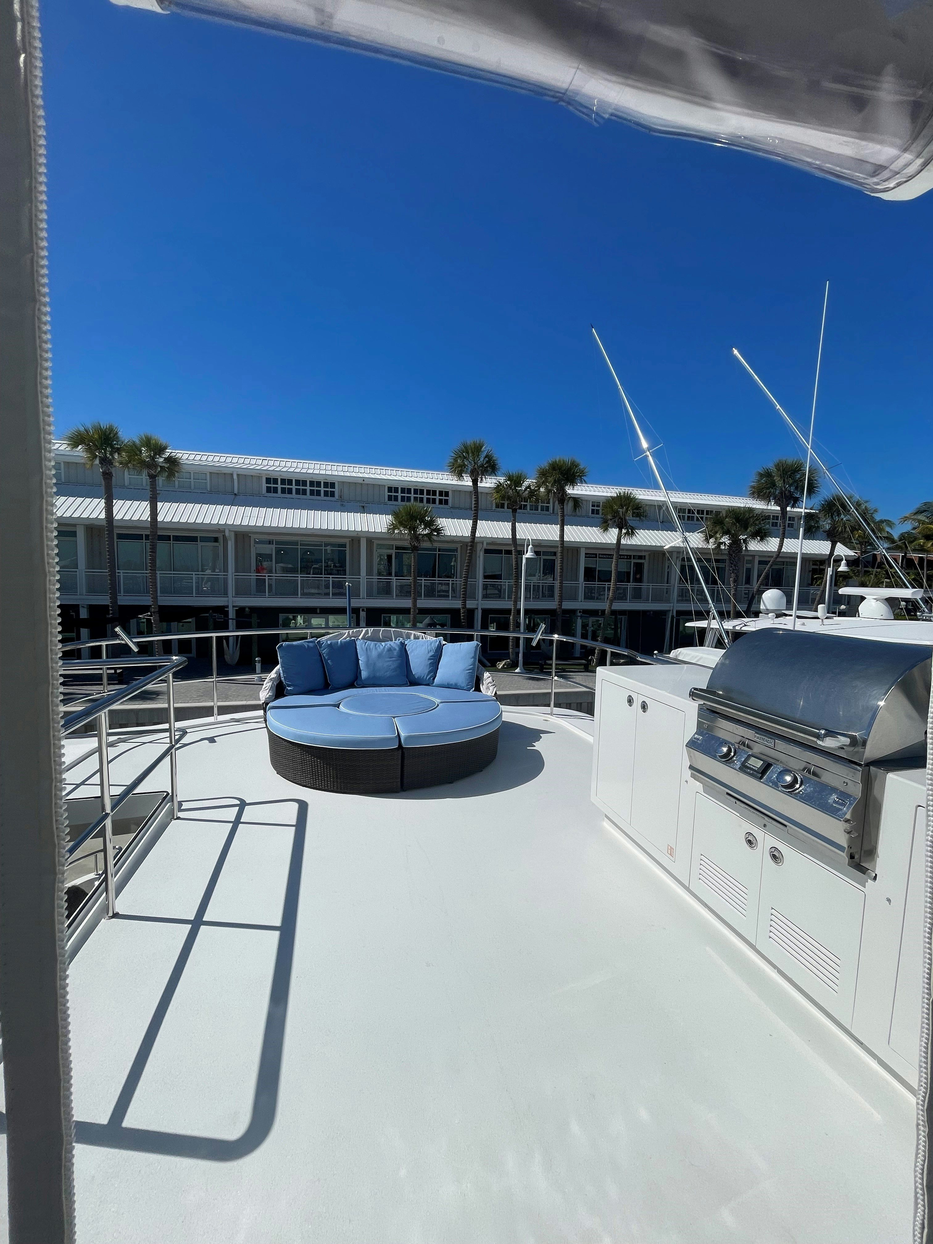 a pool with a building in the background aboard AURORA Yacht for Sale