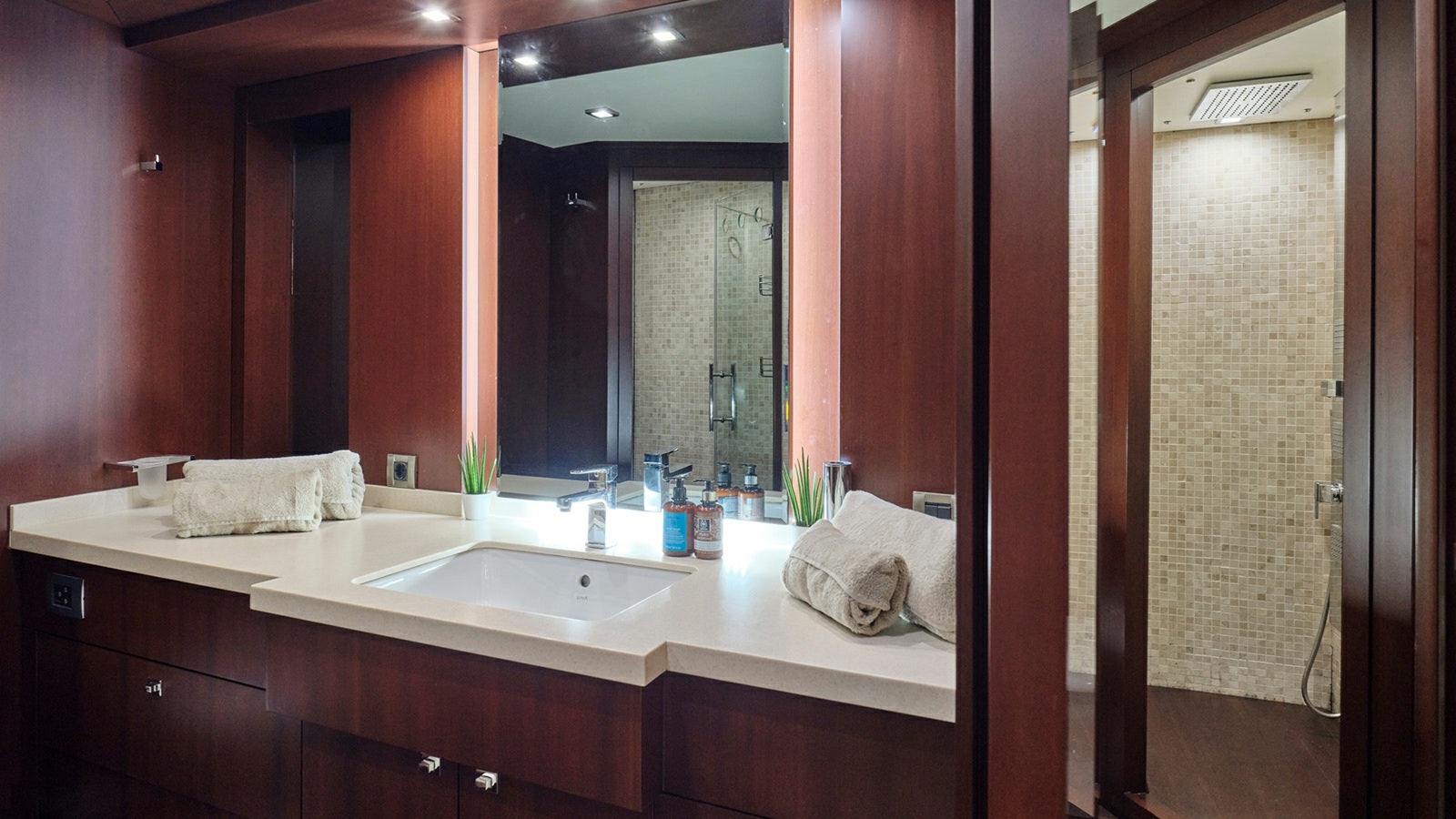 a bathroom with a sink and a mirror aboard SANJANA Yacht for Charter