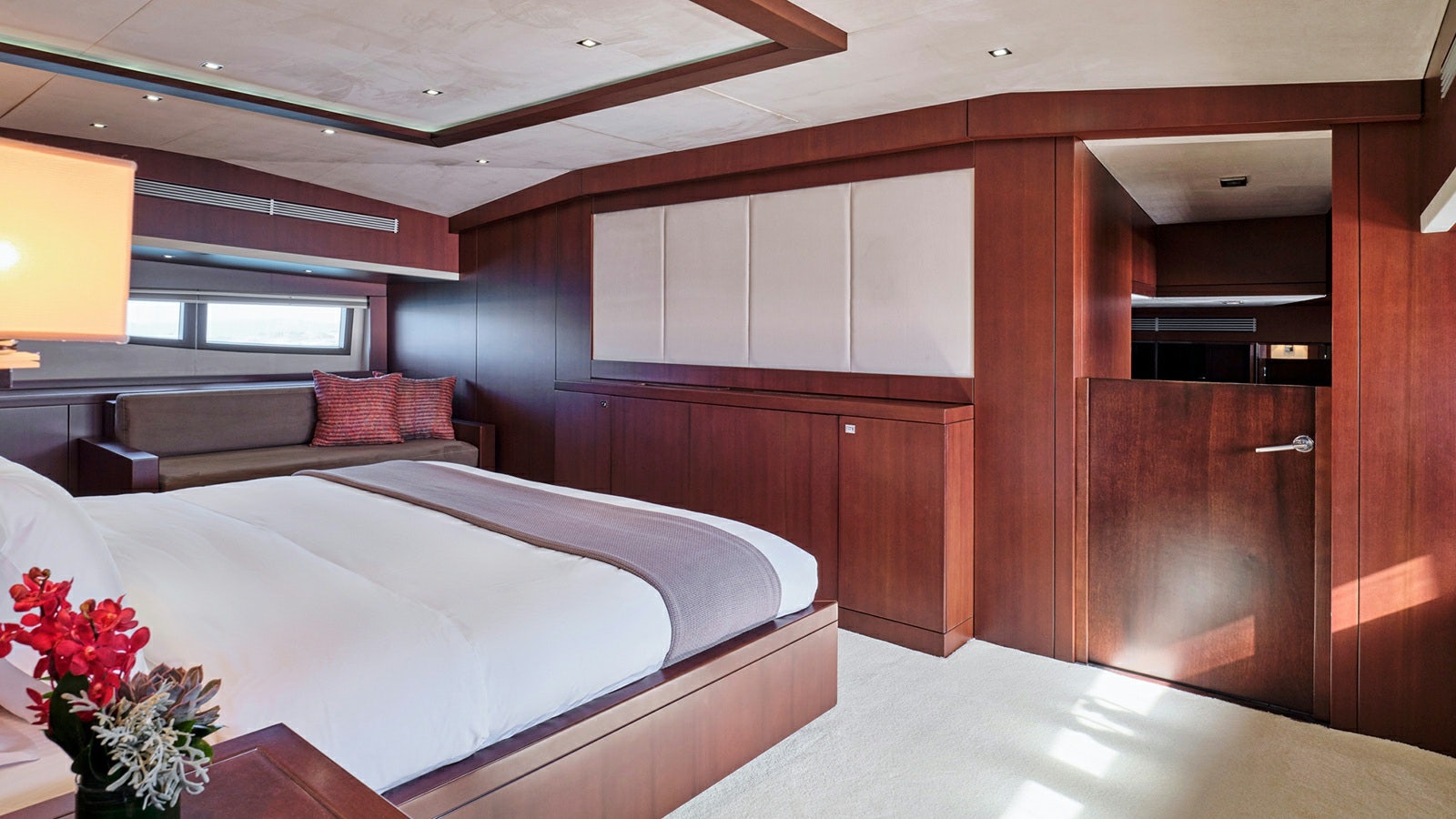 a room with a bed and a couch aboard SANJANA Yacht for Charter