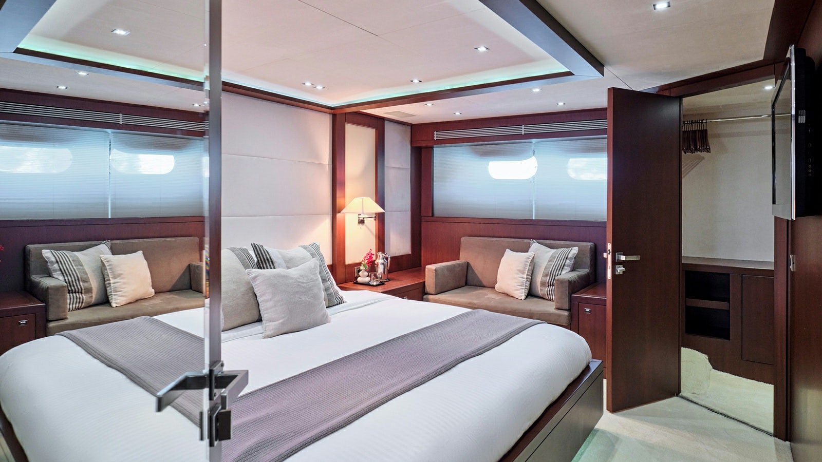 a room with a bed and a couch aboard SANJANA Yacht for Charter