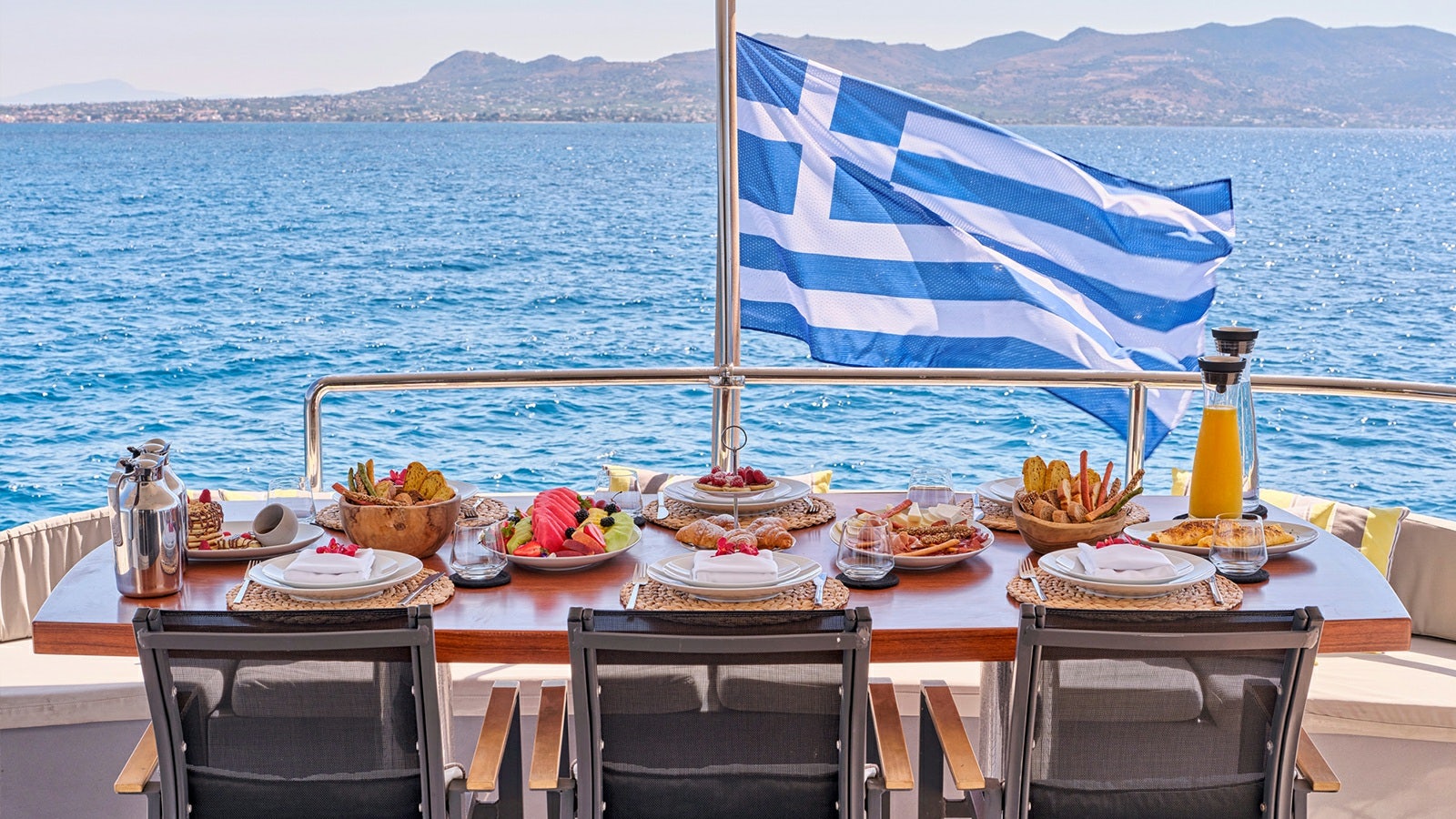 a table with food on it aboard SANJANA Yacht for Charter