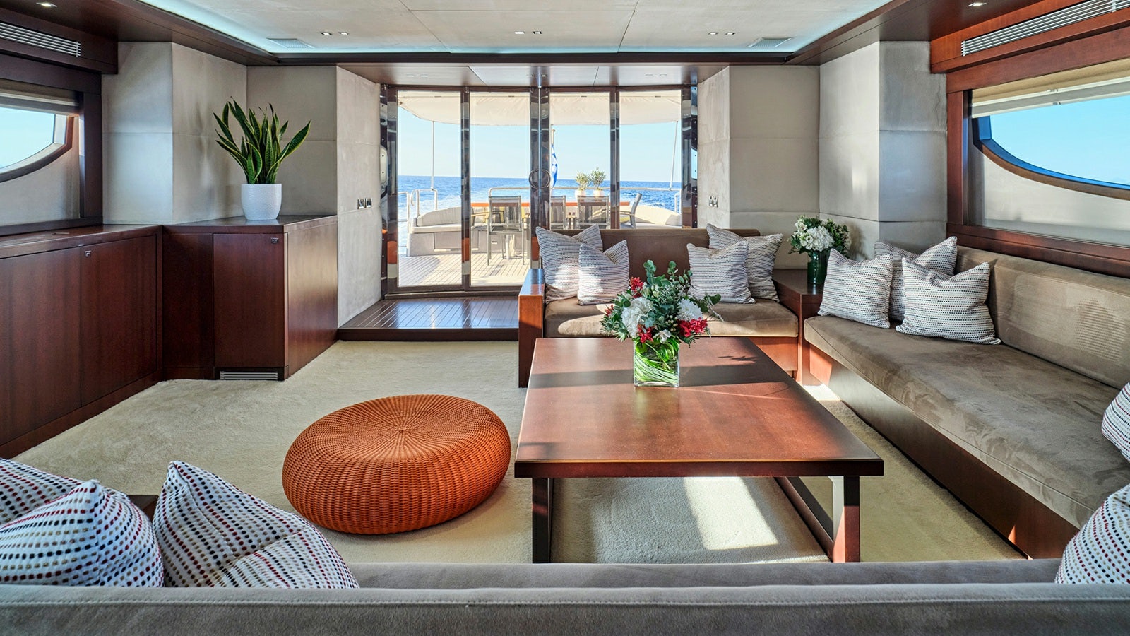 a living room with a large window aboard SANJANA Yacht for Charter