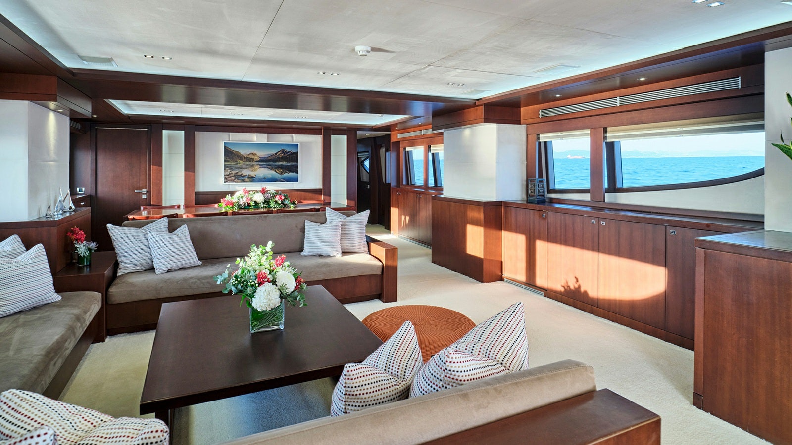 a living room with a couch and a table aboard SANJANA Yacht for Charter