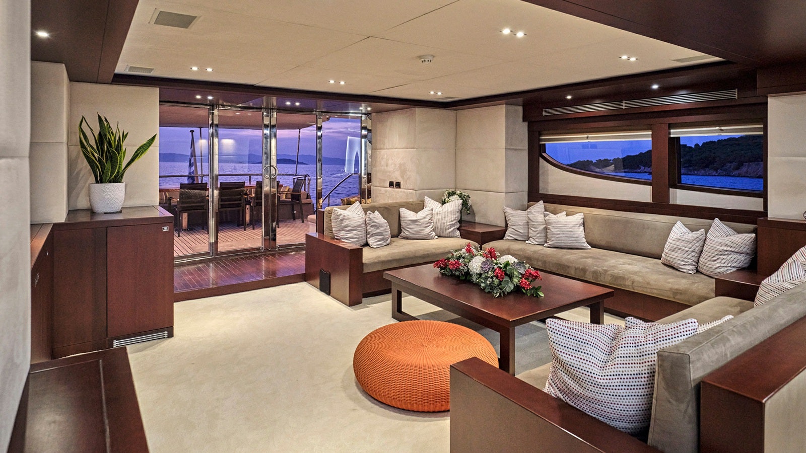 a living room with a couch and a coffee table aboard SANJANA Yacht for Charter