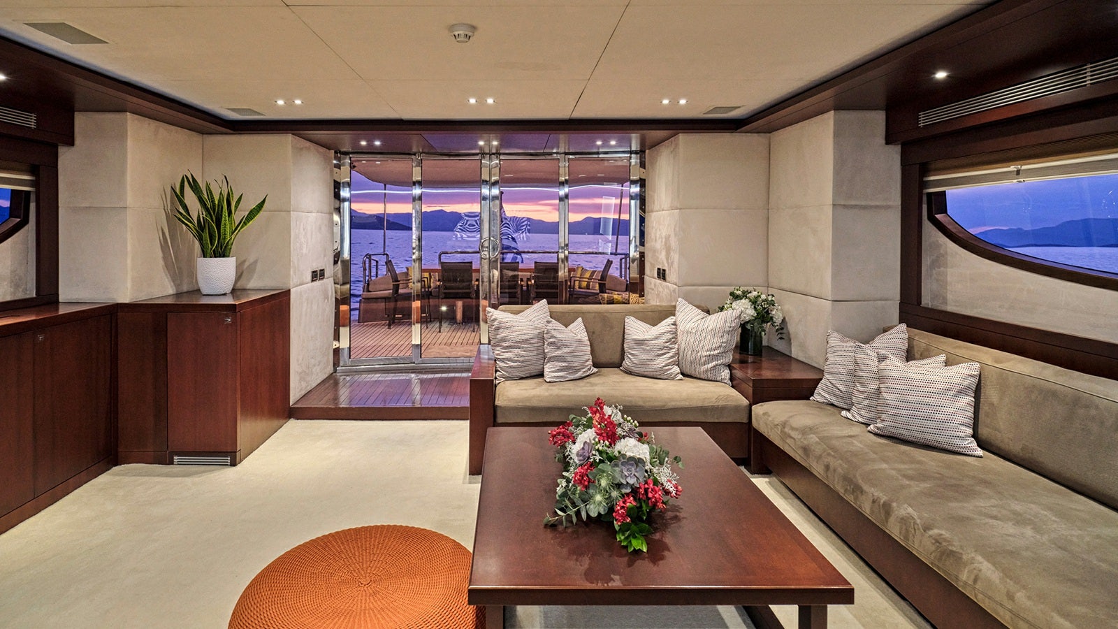a living room with a large window aboard SANJANA Yacht for Charter