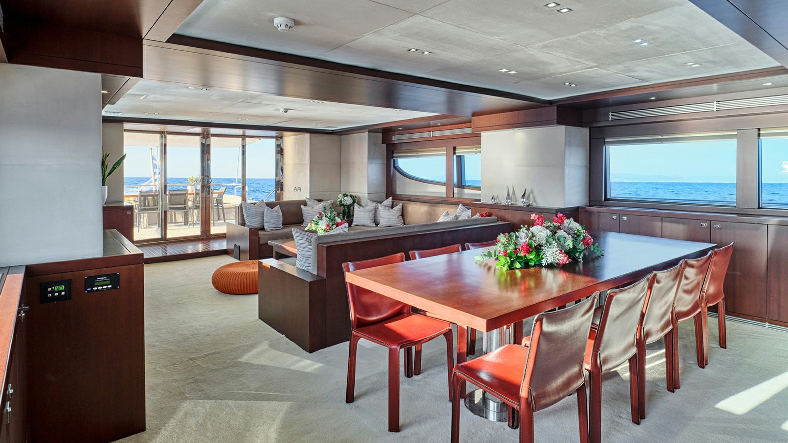 a large room with a table and chairs aboard SANJANA Yacht for Charter