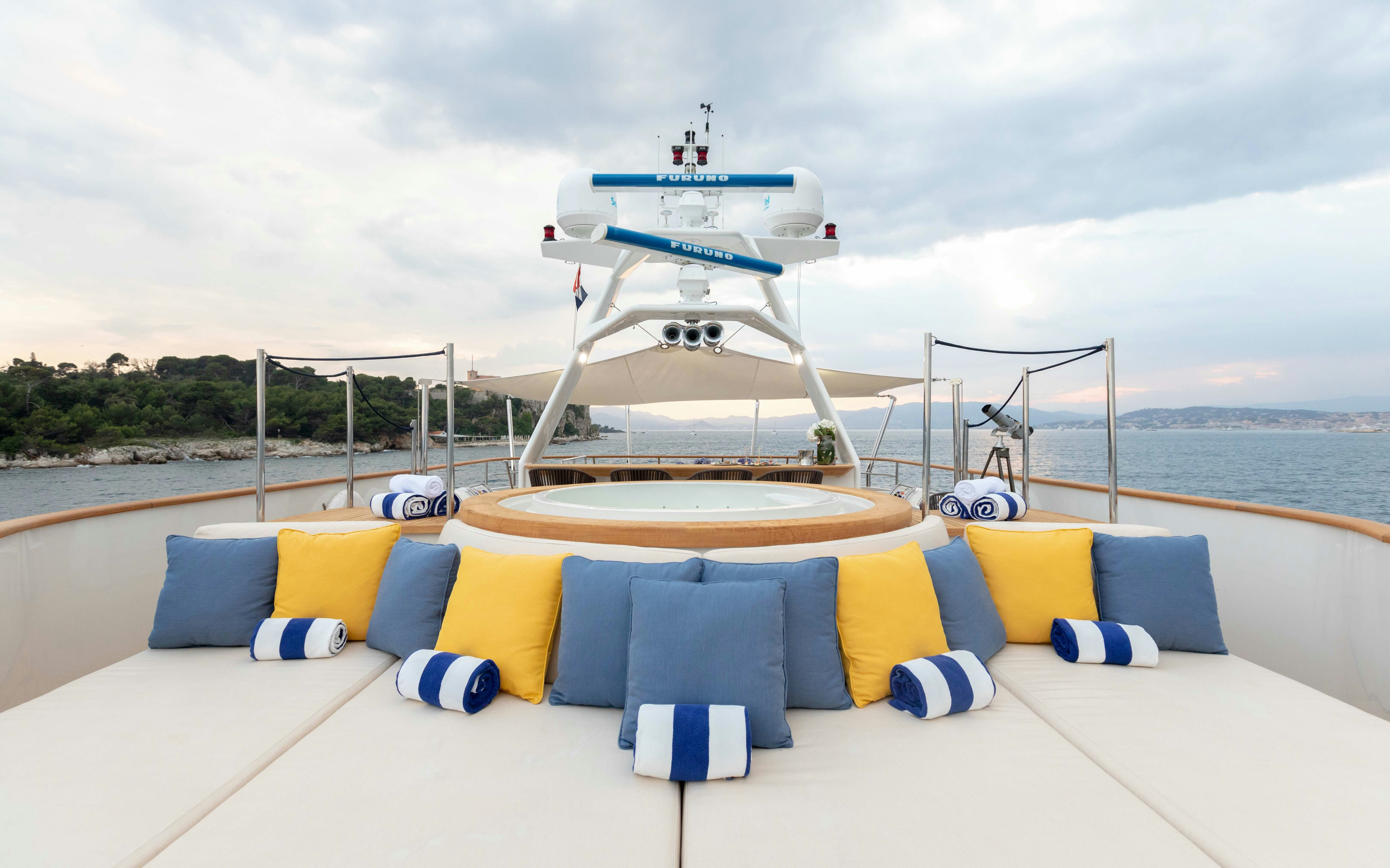 a pool with a large white structure in the background aboard ROBBIE BOBBY Yacht for Sale