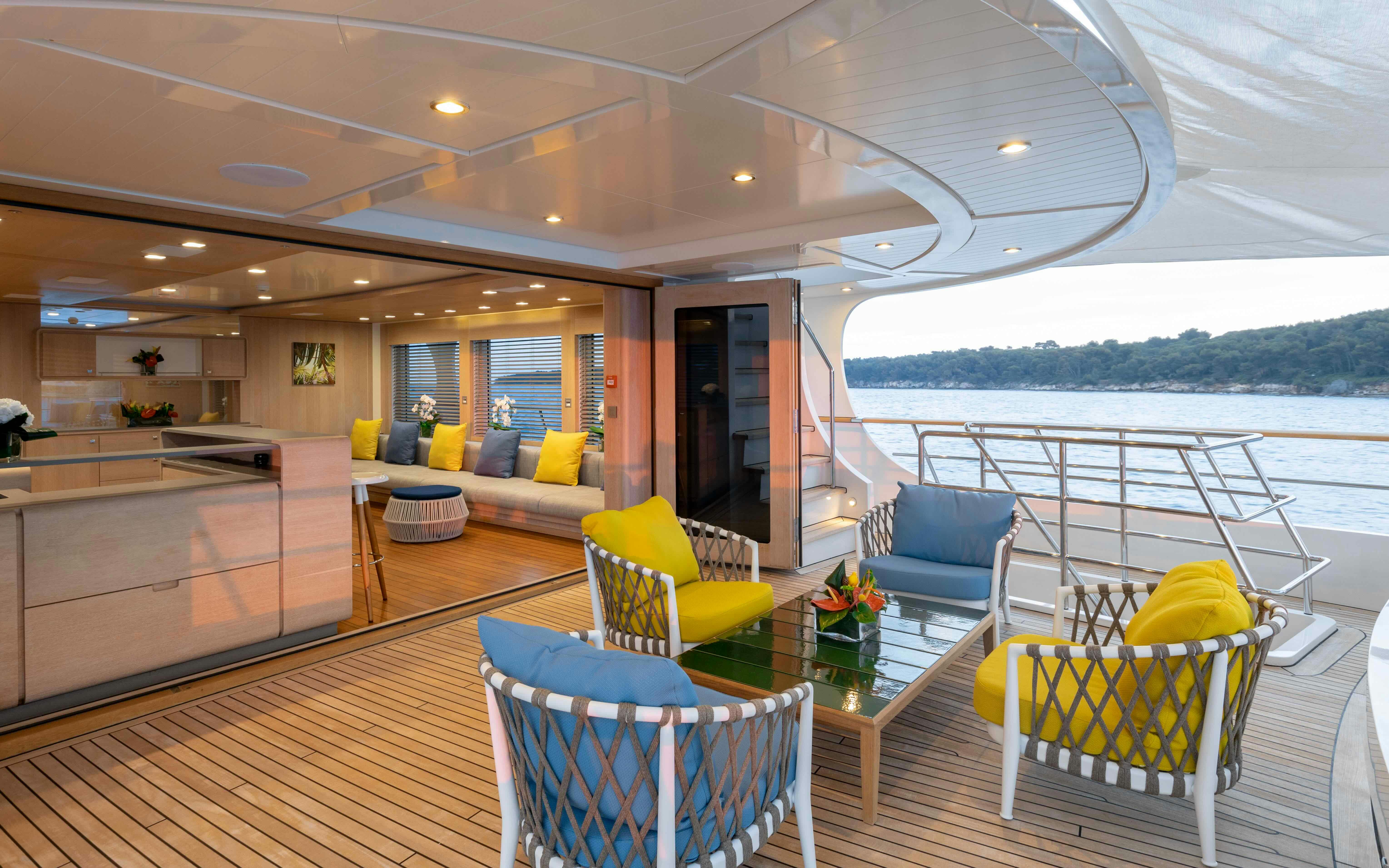 a living room with a large balcony aboard ROBBIE BOBBY Yacht for Sale