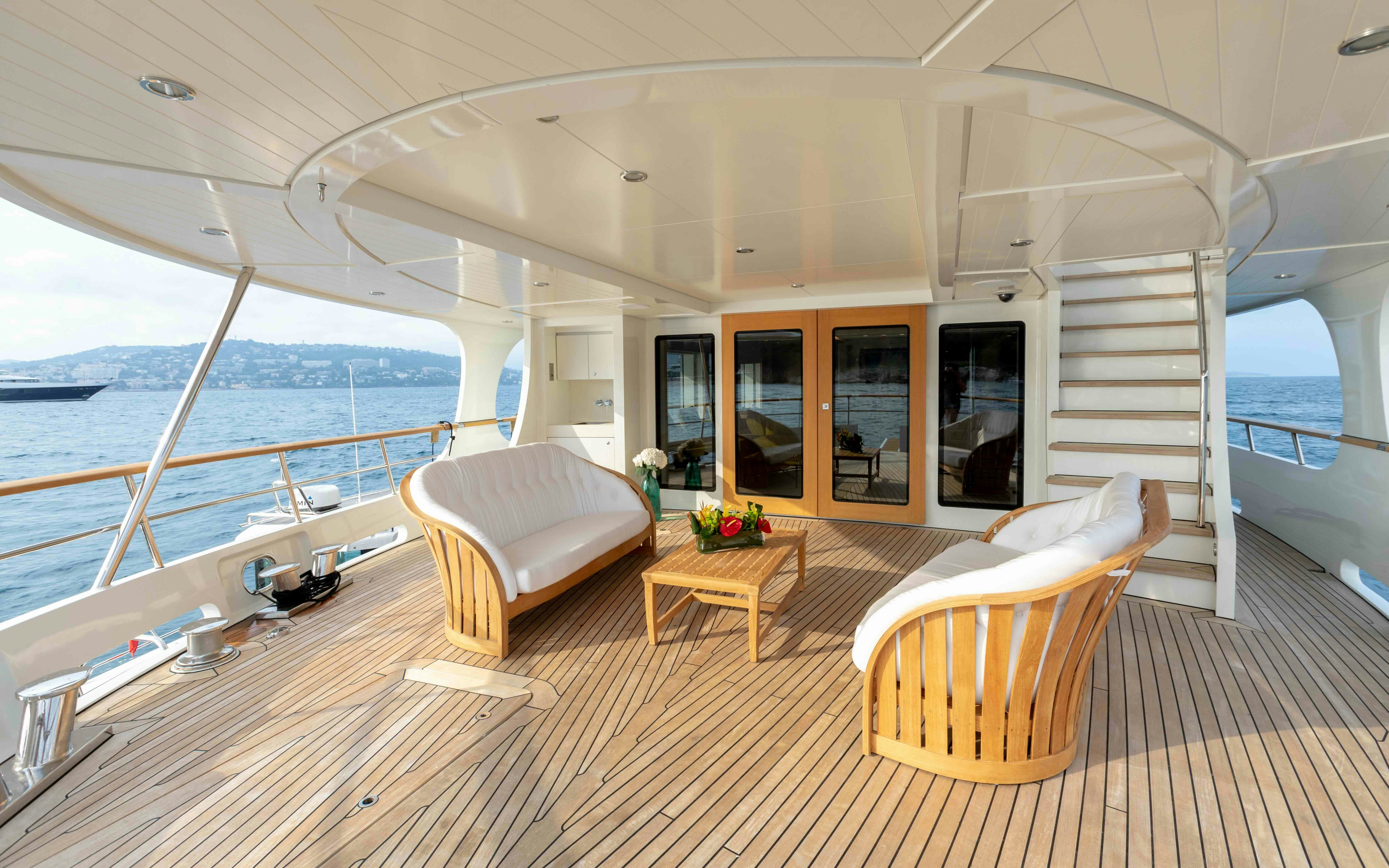 a living room with a large balcony aboard ROBBIE BOBBY Yacht for Sale