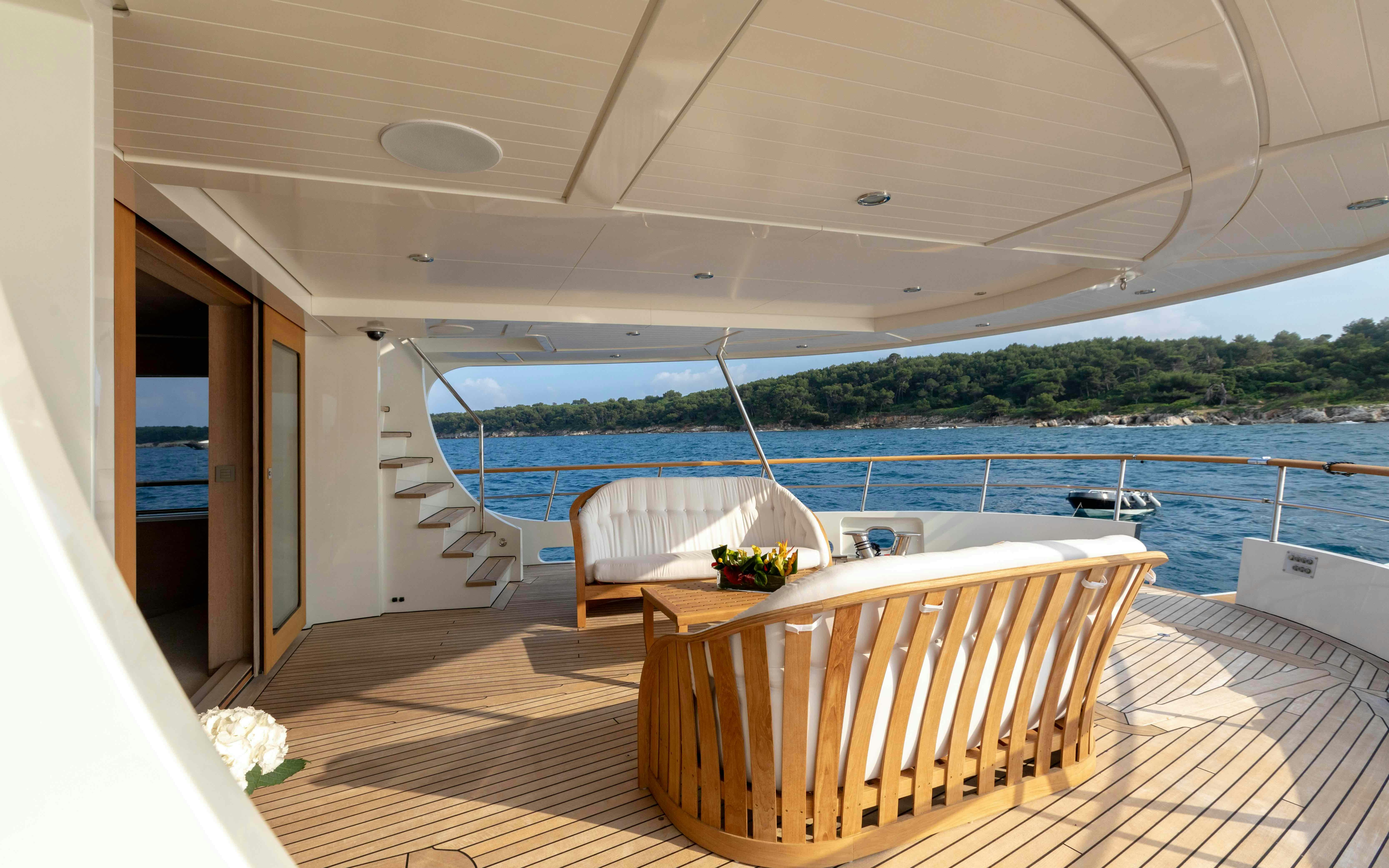 a room with a table and chairs aboard ROBBIE BOBBY Yacht for Sale