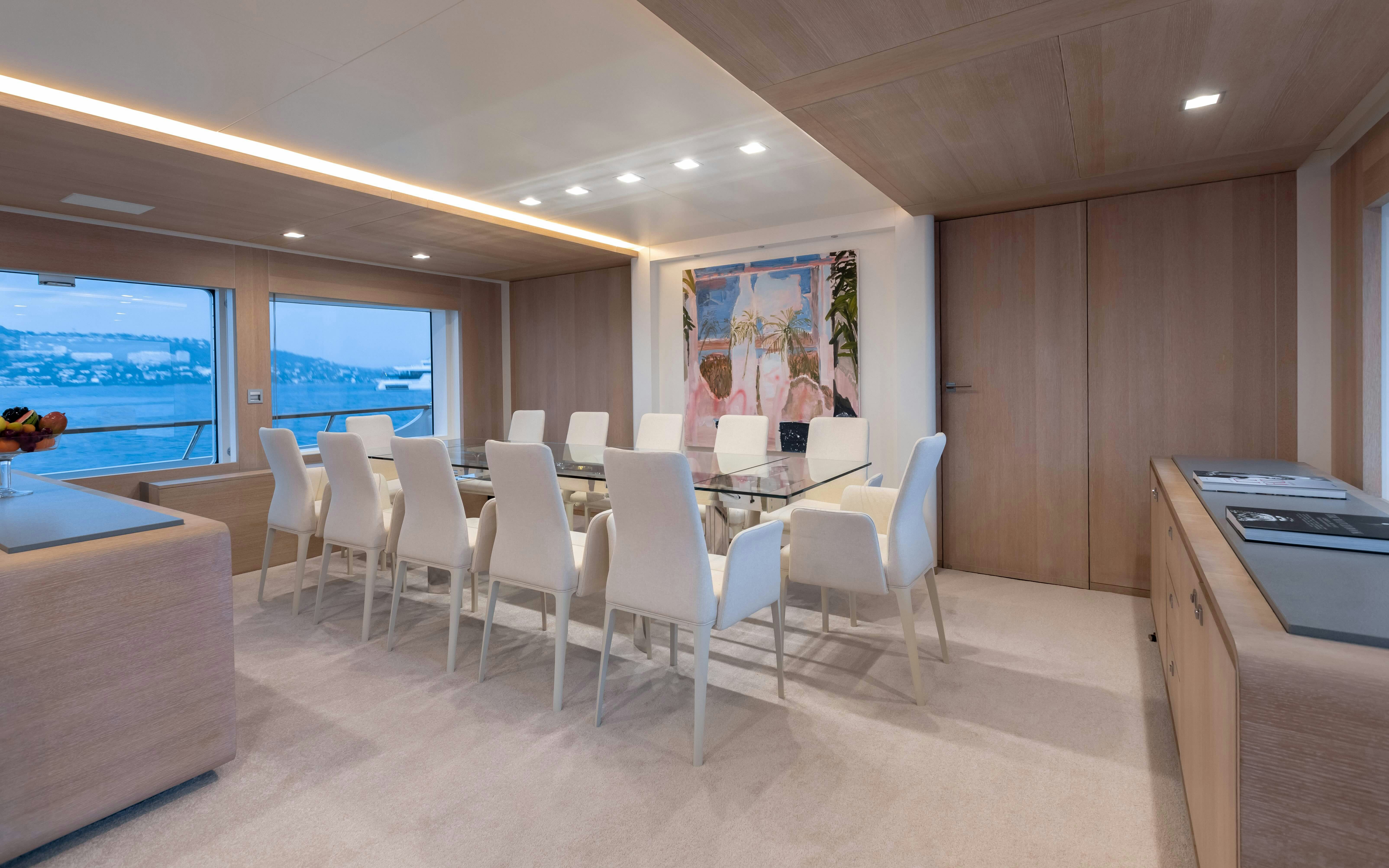 a room with chairs and a table aboard ROBBIE BOBBY Yacht for Sale