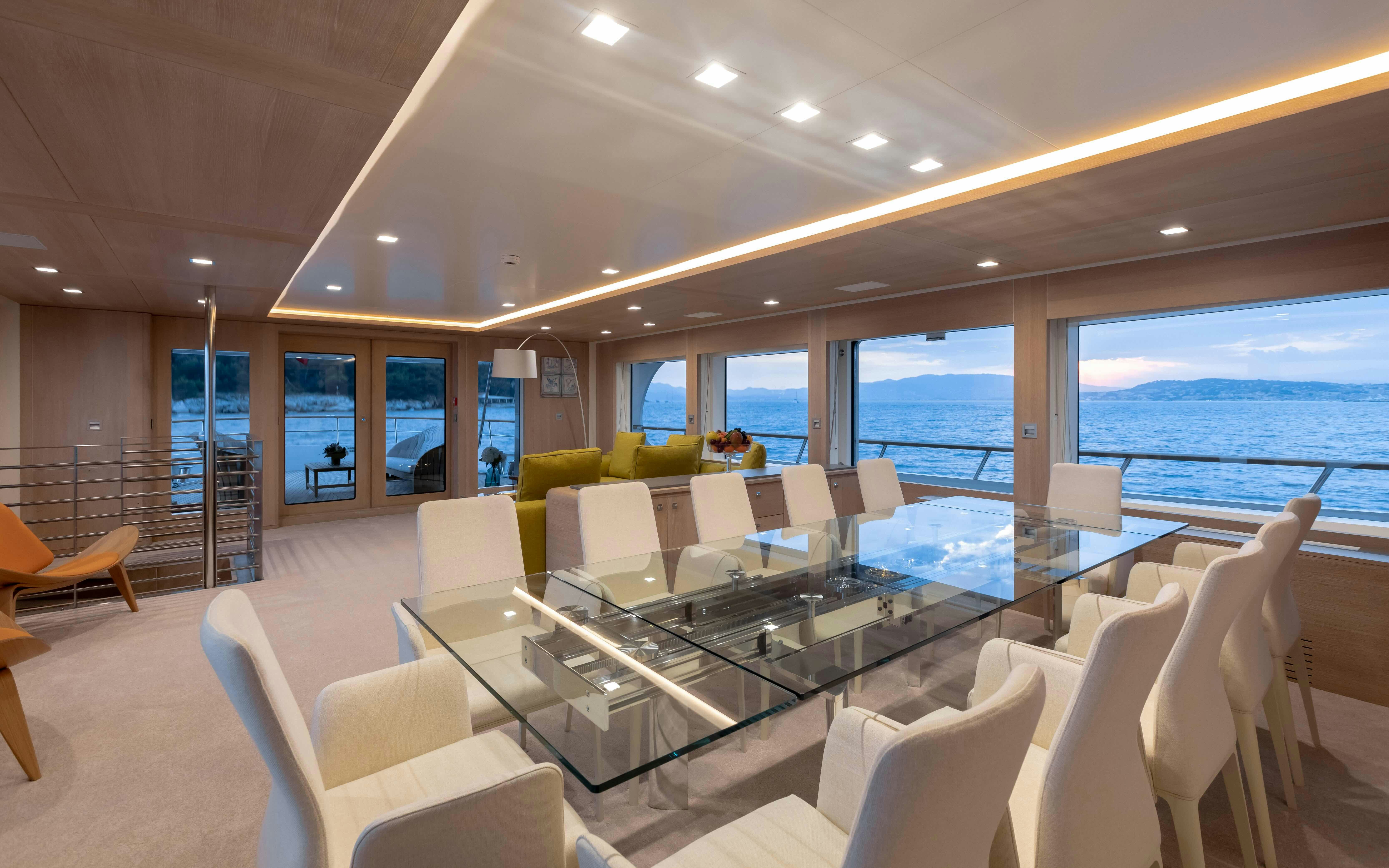 a room with a table chairs and a large window aboard ROBBIE BOBBY Yacht for Sale
