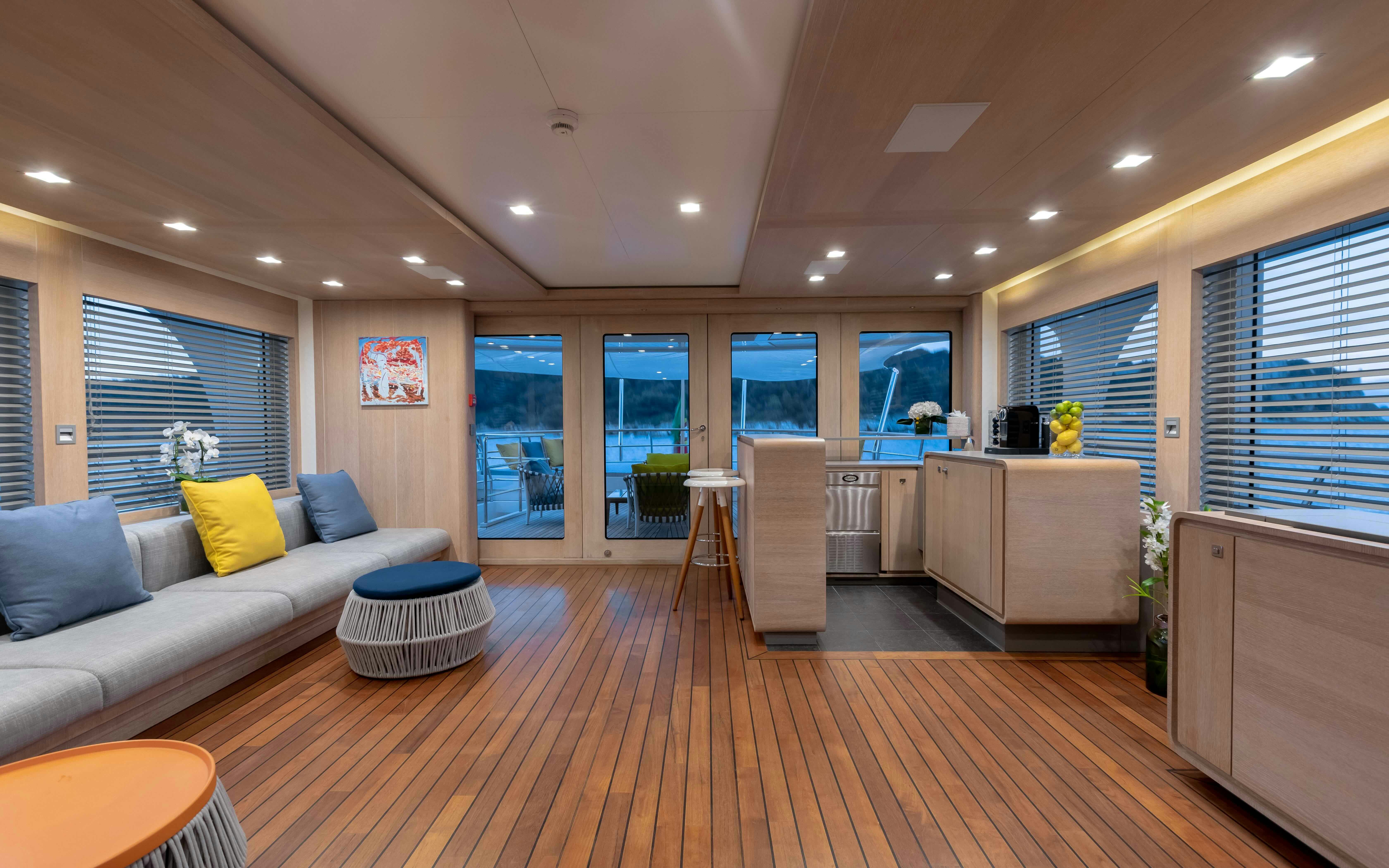a living room with a wood floor aboard ROBBIE BOBBY Yacht for Sale