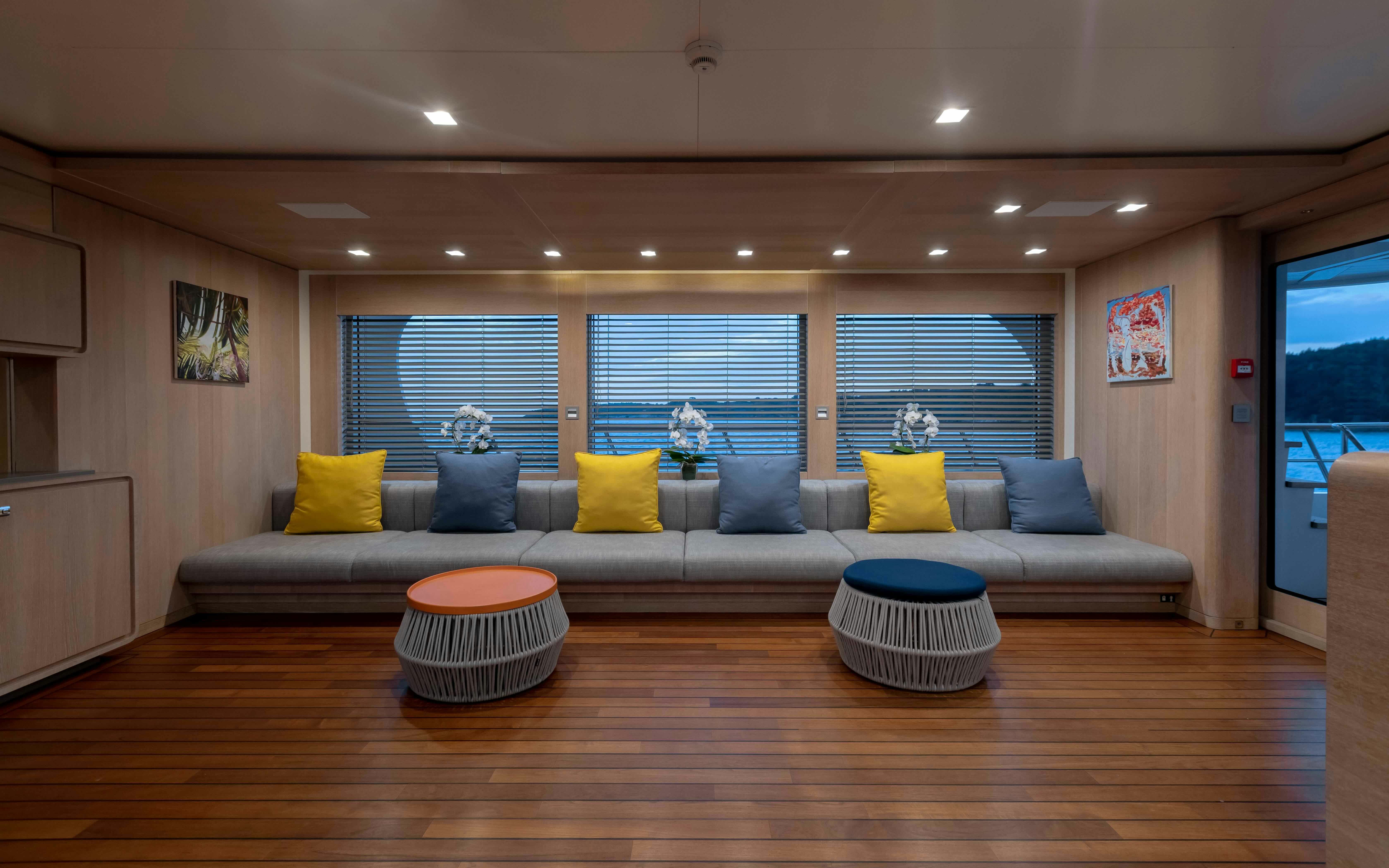 a living room with a couch and a table aboard ROBBIE BOBBY Yacht for Sale