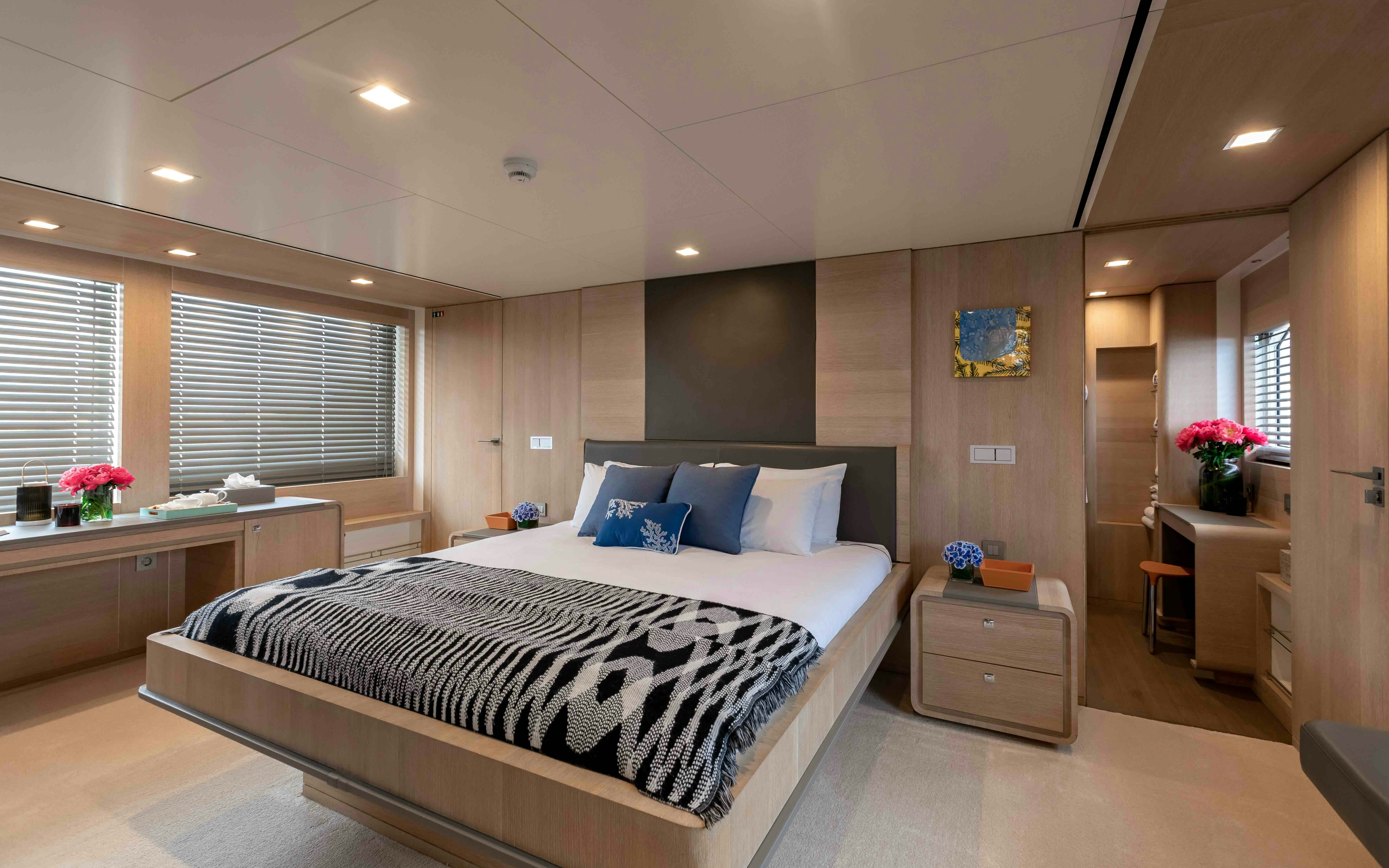 a large bedroom with a bed aboard ROBBIE BOBBY Yacht for Sale