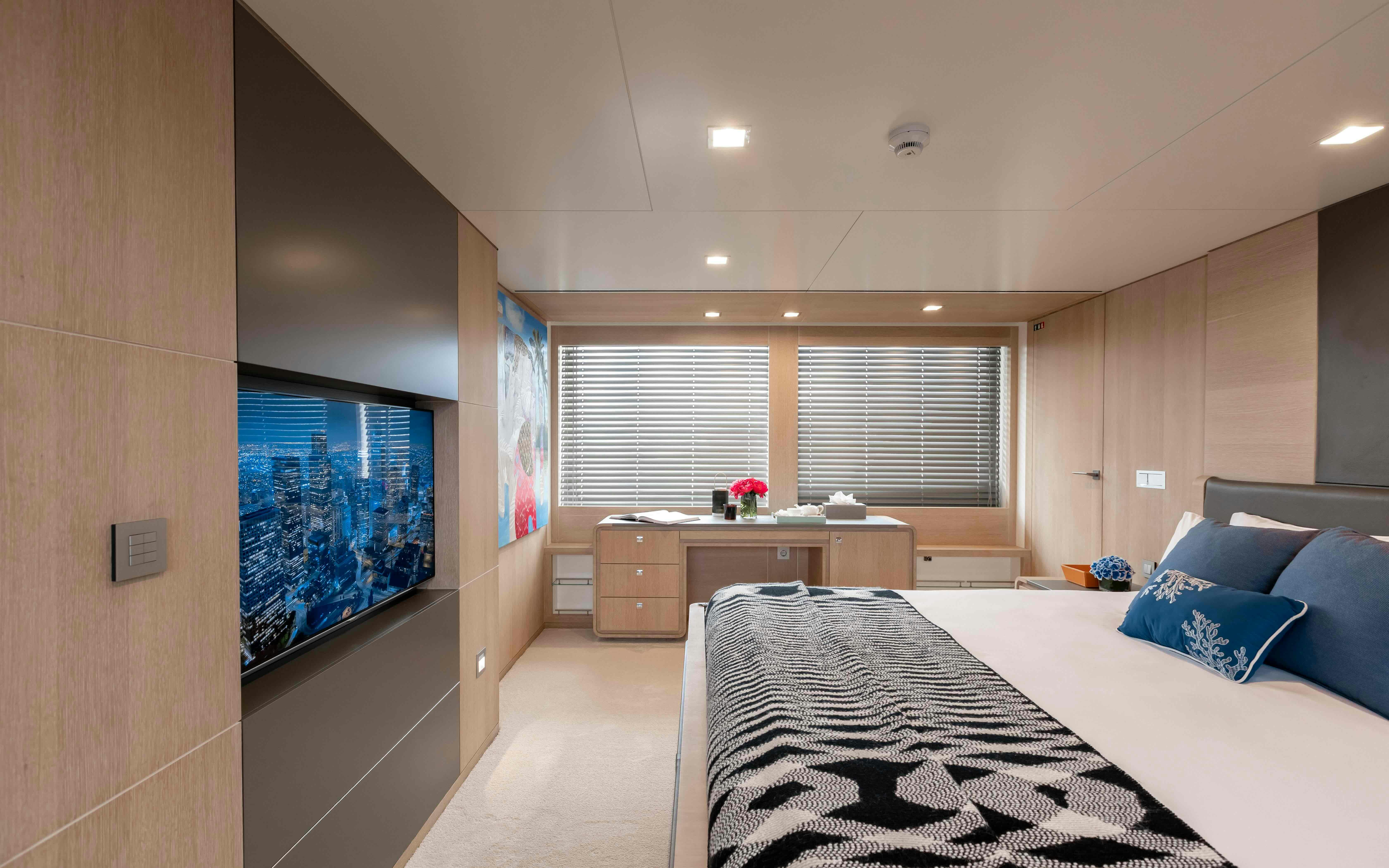 a bedroom with a large bed aboard ROBBIE BOBBY Yacht for Sale
