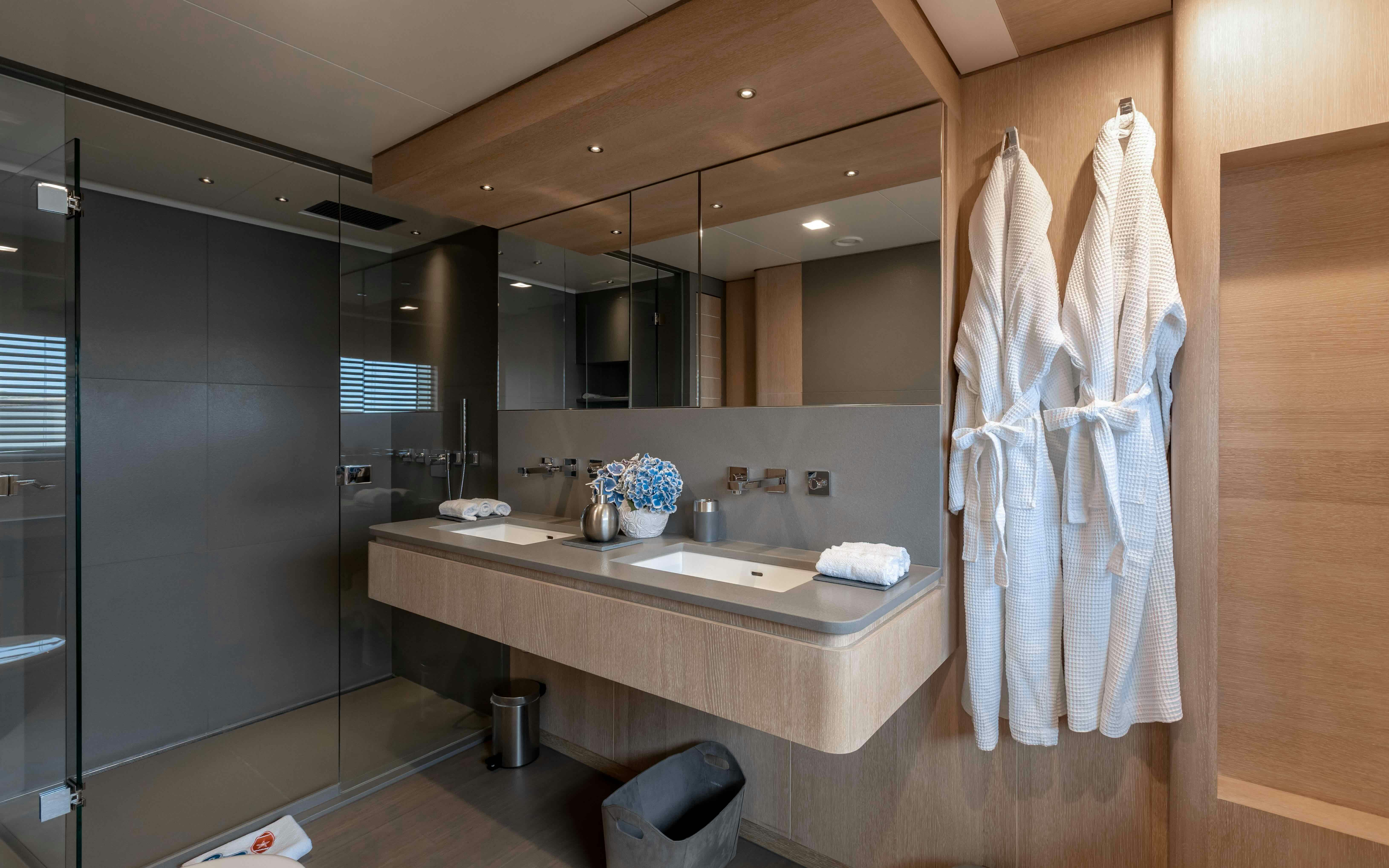 a bathroom with a sink and a mirror aboard ROBBIE BOBBY Yacht for Sale