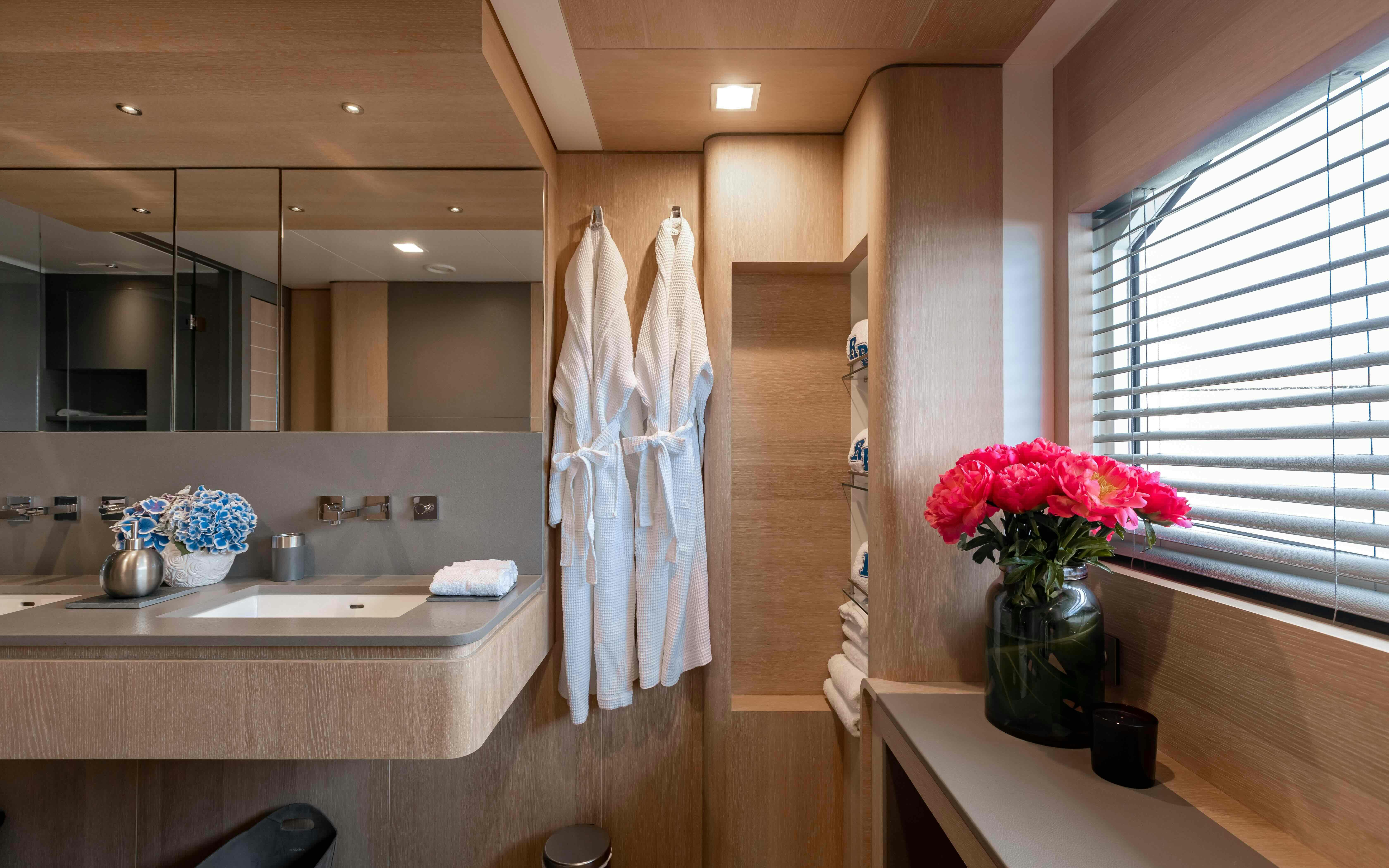 a bathroom with a sink and a mirror aboard ROBBIE BOBBY Yacht for Sale