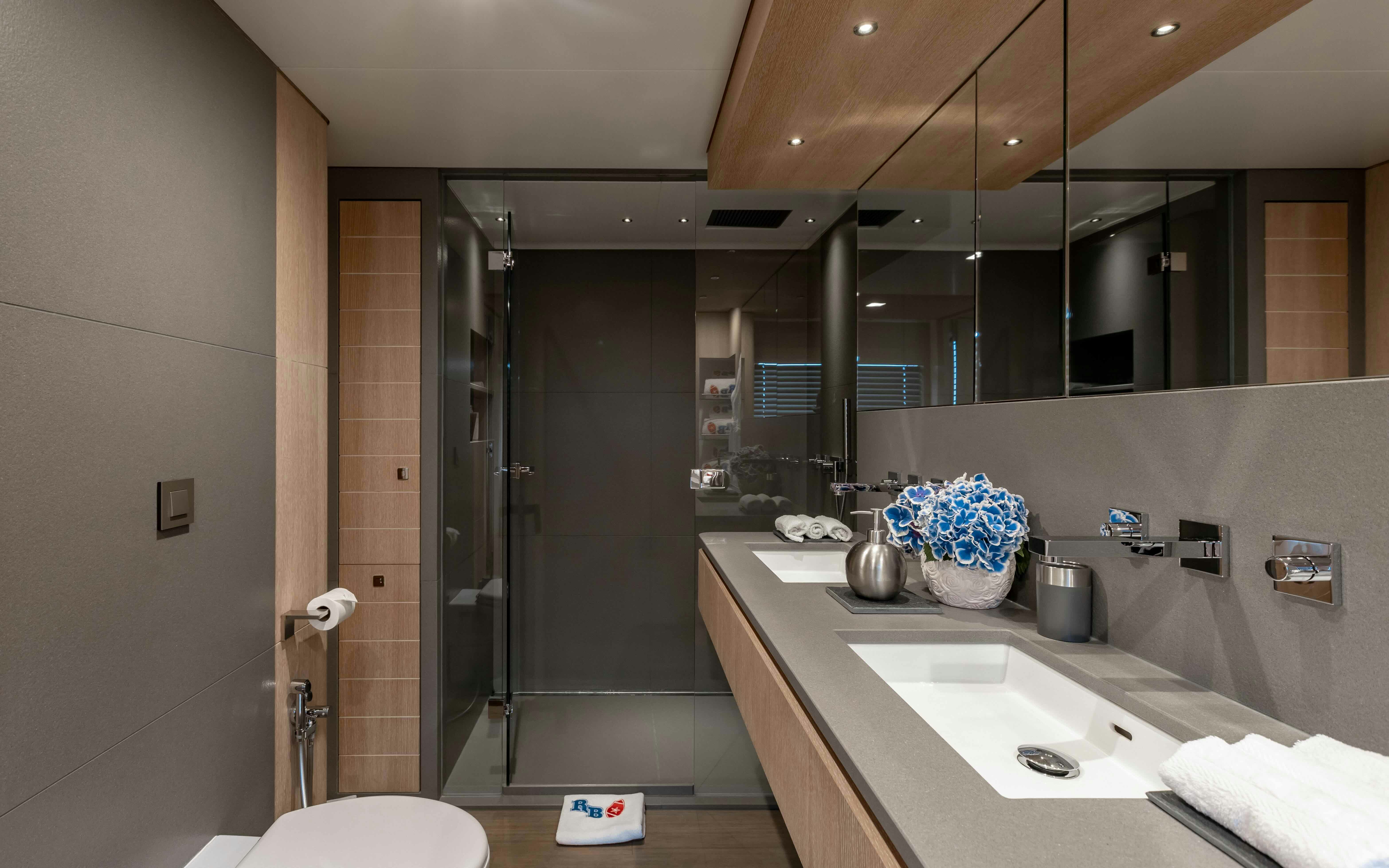 a bathroom with a large mirror aboard ROBBIE BOBBY Yacht for Sale