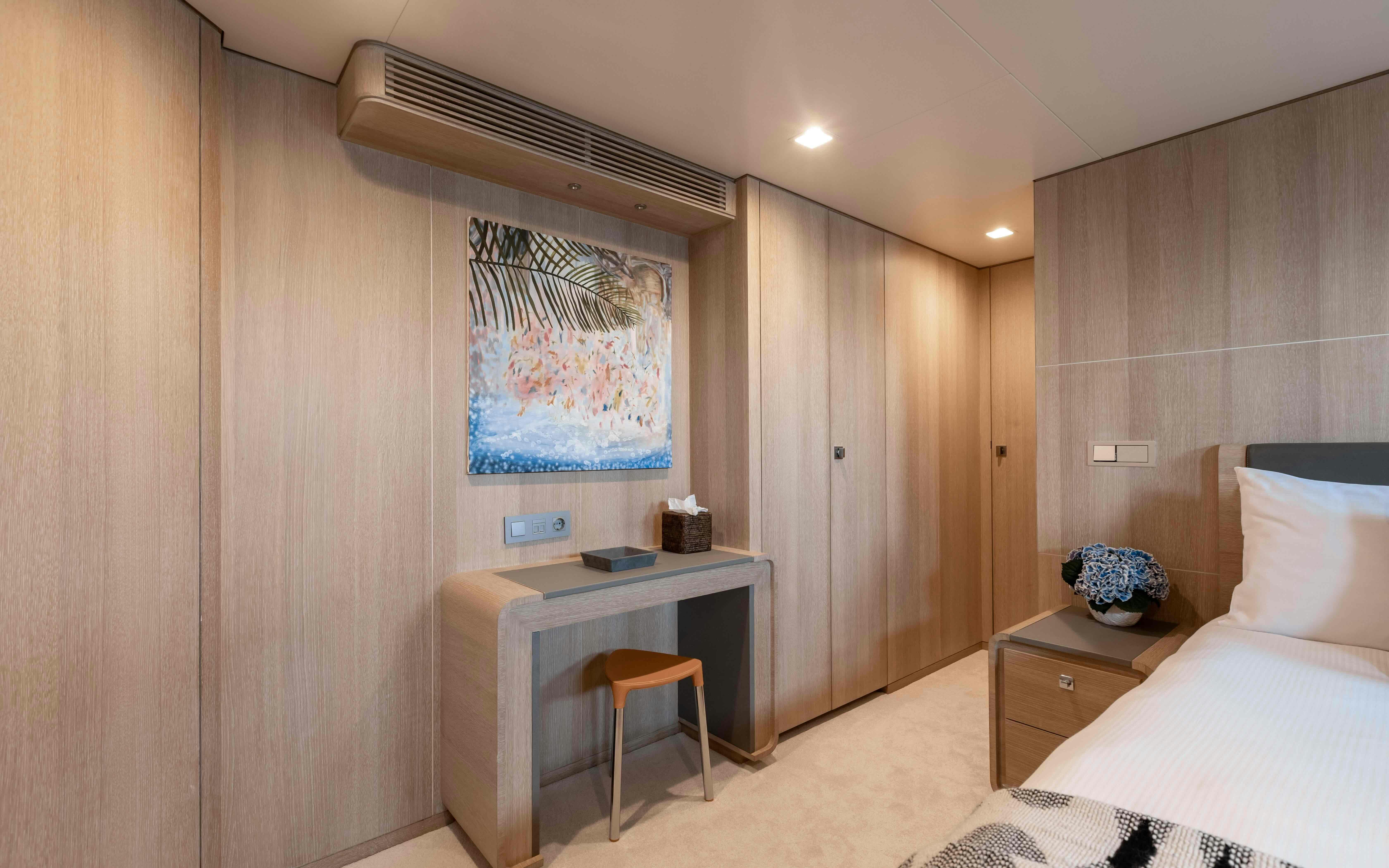 a room with a desk and a bed aboard ROBBIE BOBBY Yacht for Sale