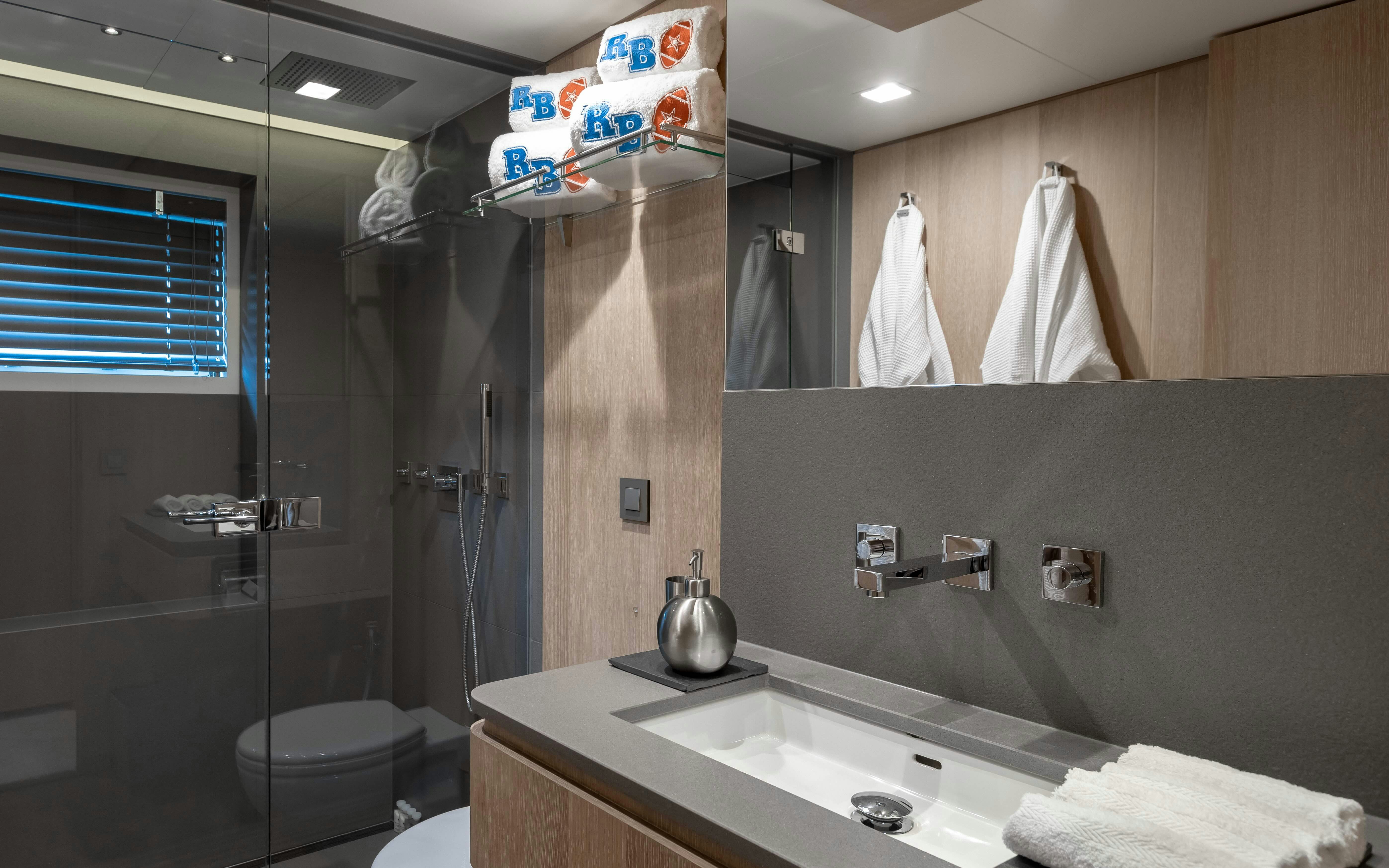a bathroom with a glass shower aboard ROBBIE BOBBY Yacht for Sale