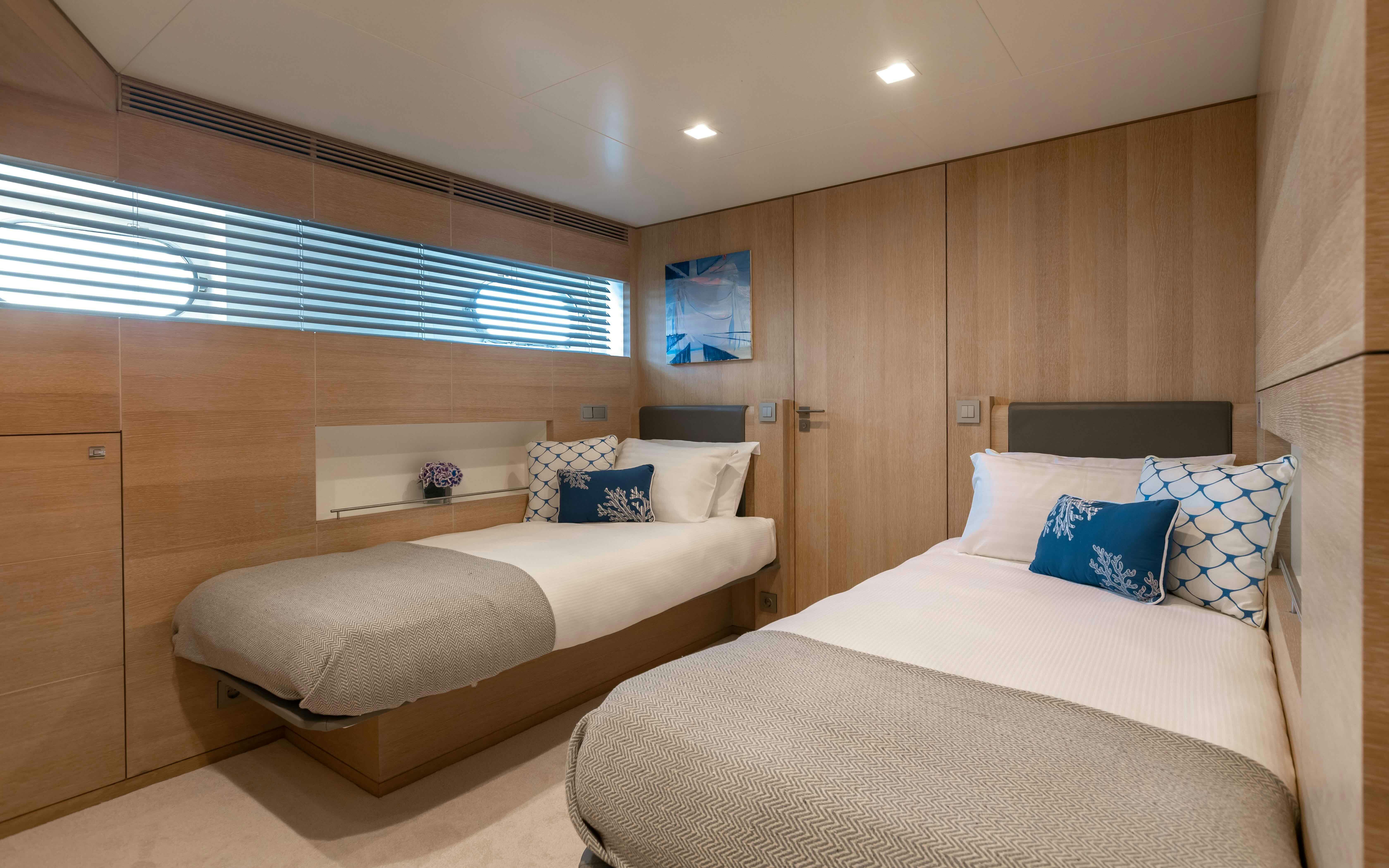 a room with a bed and a desk aboard ROBBIE BOBBY Yacht for Sale