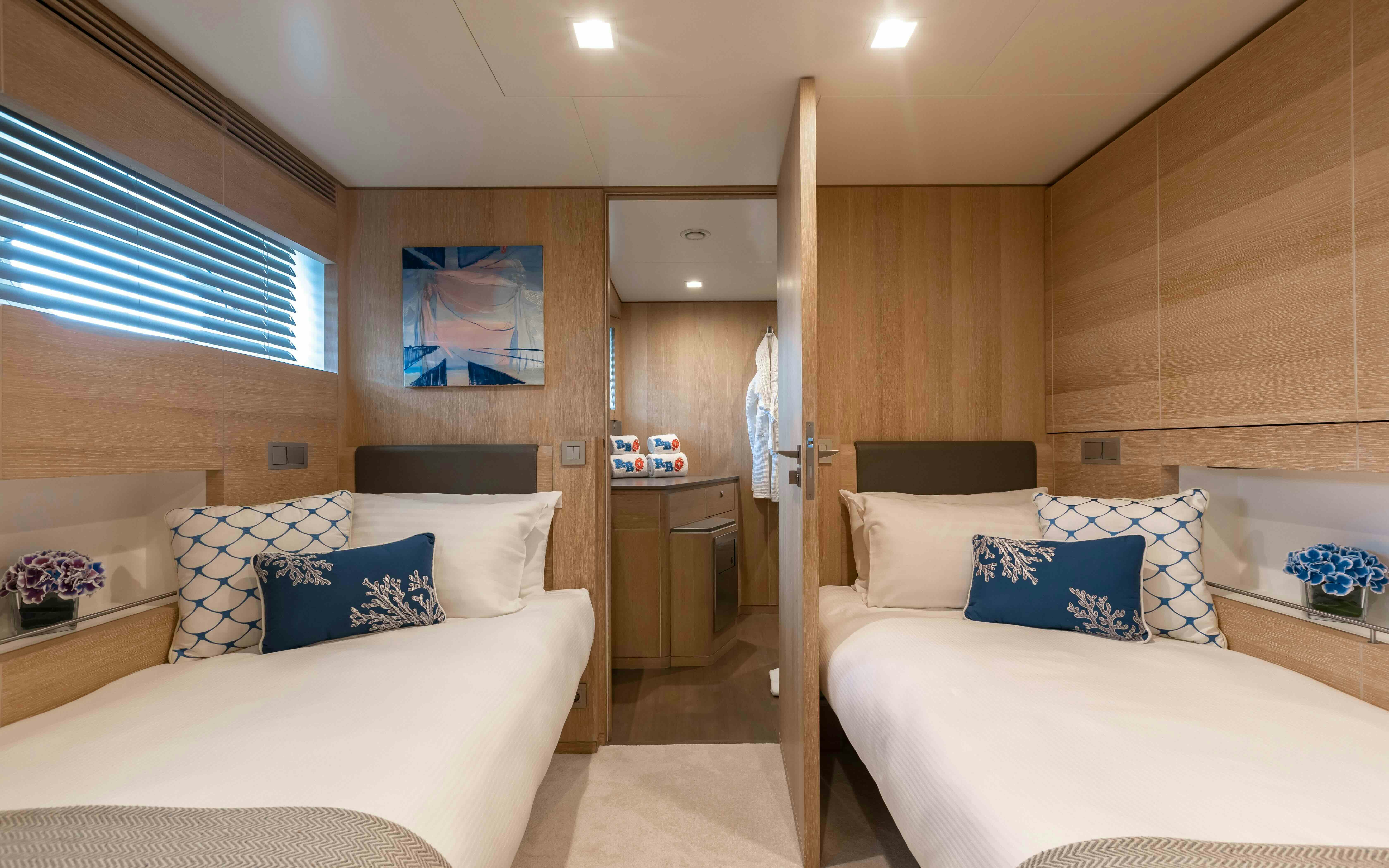 a room with a bed and a door aboard ROBBIE BOBBY Yacht for Sale