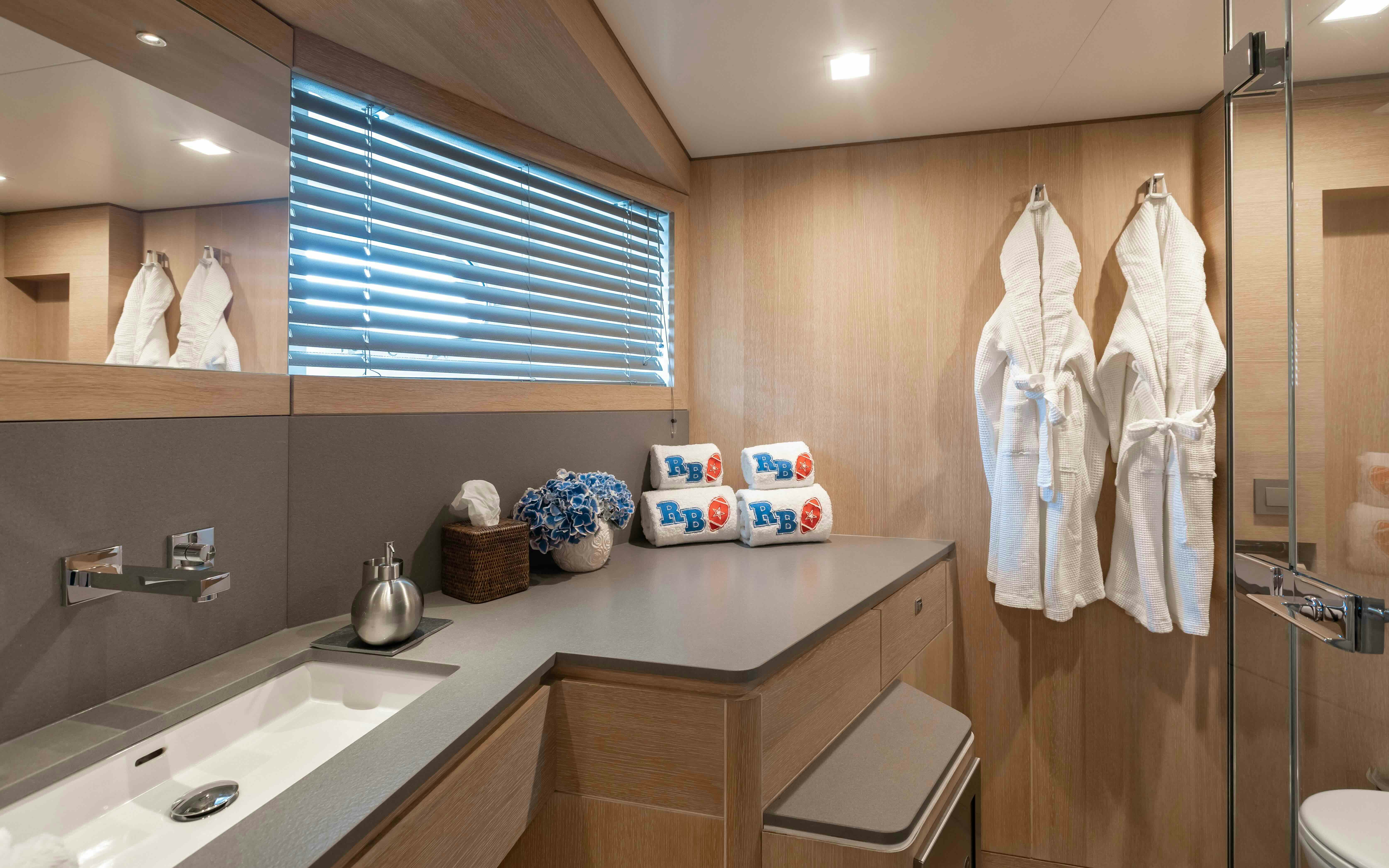 a bathroom with a sink and a mirror aboard ROBBIE BOBBY Yacht for Sale