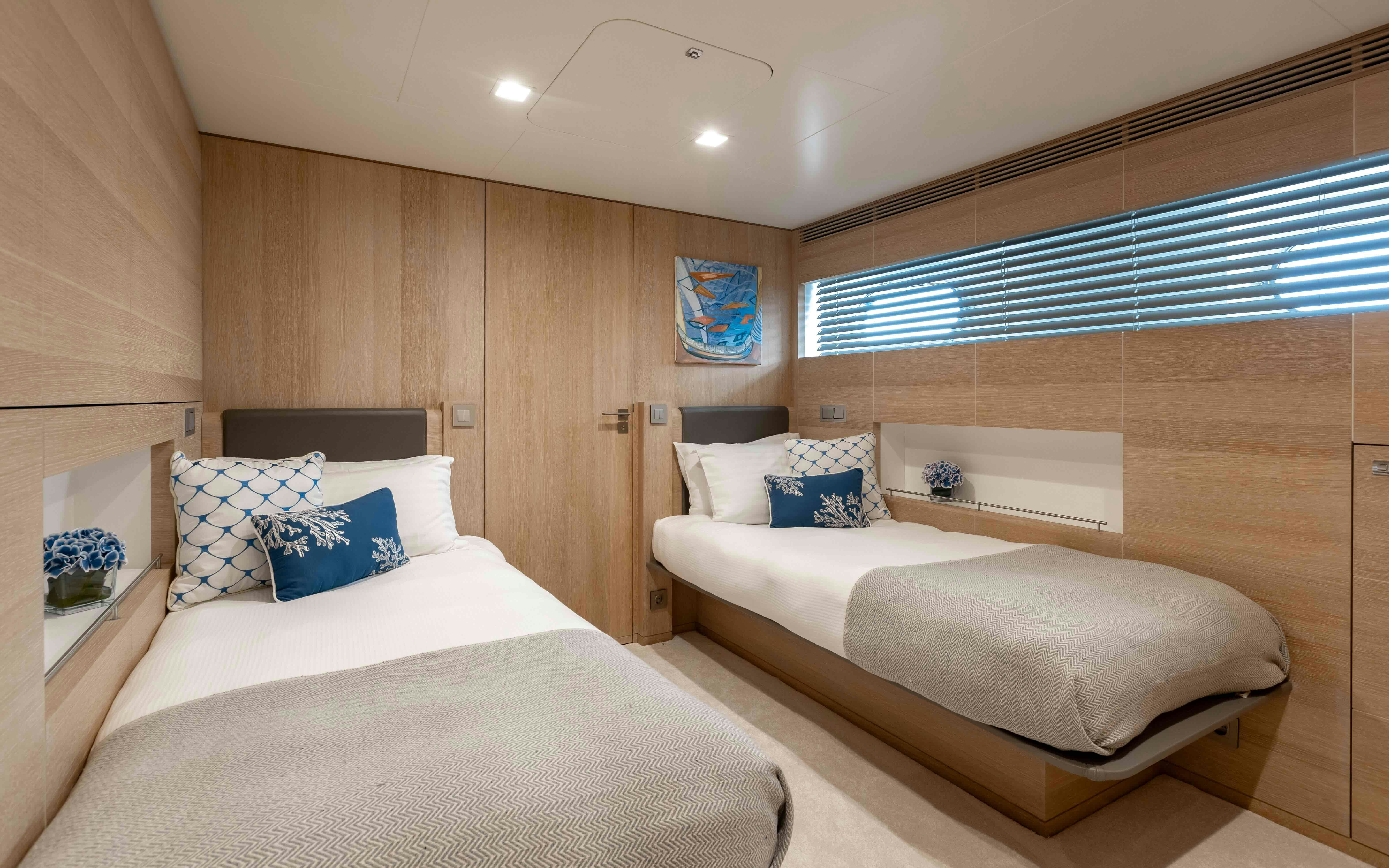 a room with a bed and a desk aboard ROBBIE BOBBY Yacht for Sale