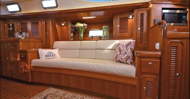 a couch in a room aboard SAUCY FOX Yacht for Sale