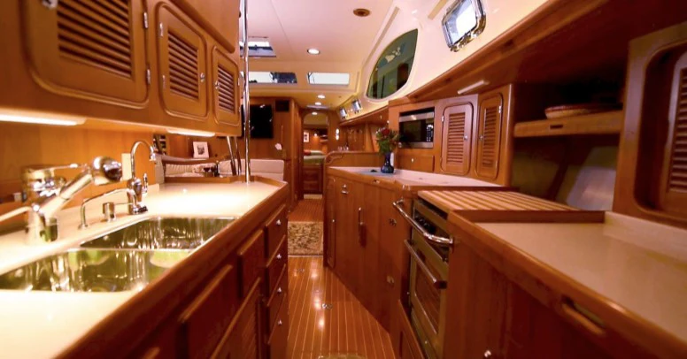a kitchen with a large island aboard SAUCY FOX Yacht for Sale