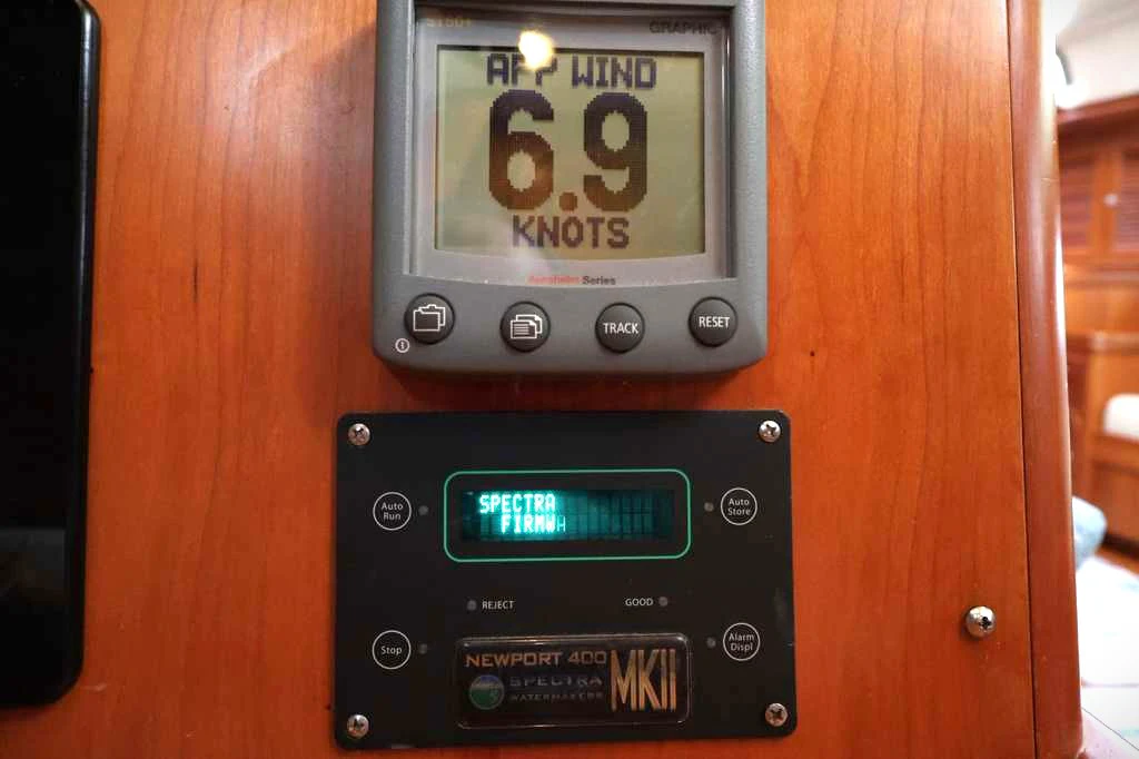 a digital clock on a wooden wall aboard SAUCY FOX Yacht for Sale