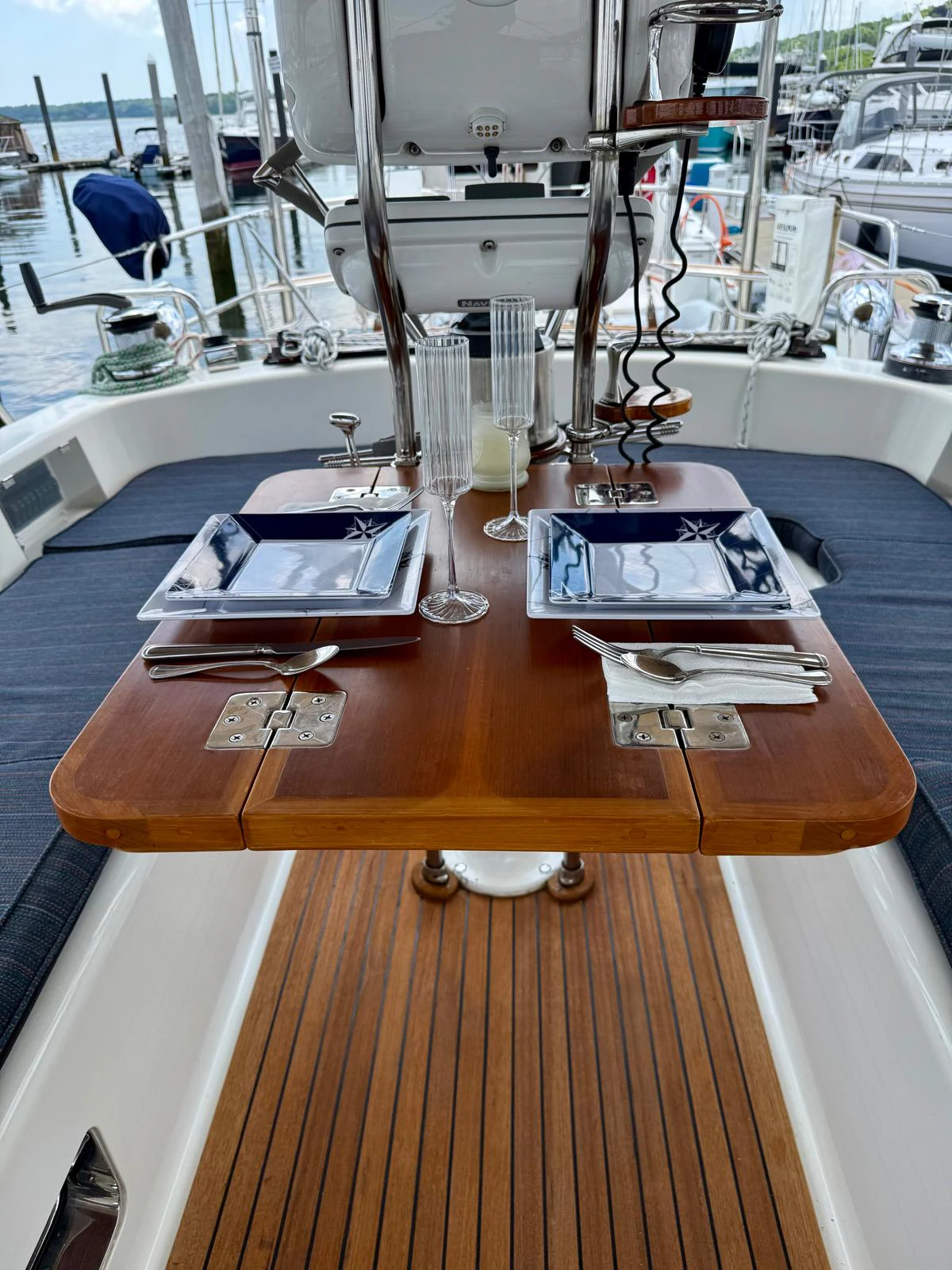 a table with a book and a book on it aboard SAUCY FOX Yacht for Sale