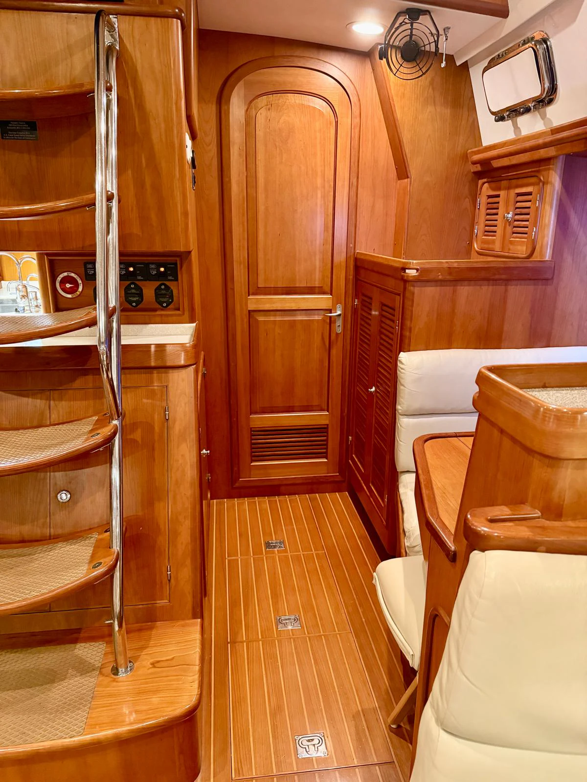 a wooden cabin with a wood door aboard SAUCY FOX Yacht for Sale