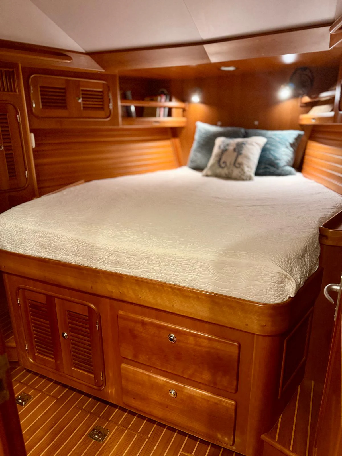 a bed with a white comforter aboard SAUCY FOX Yacht for Sale
