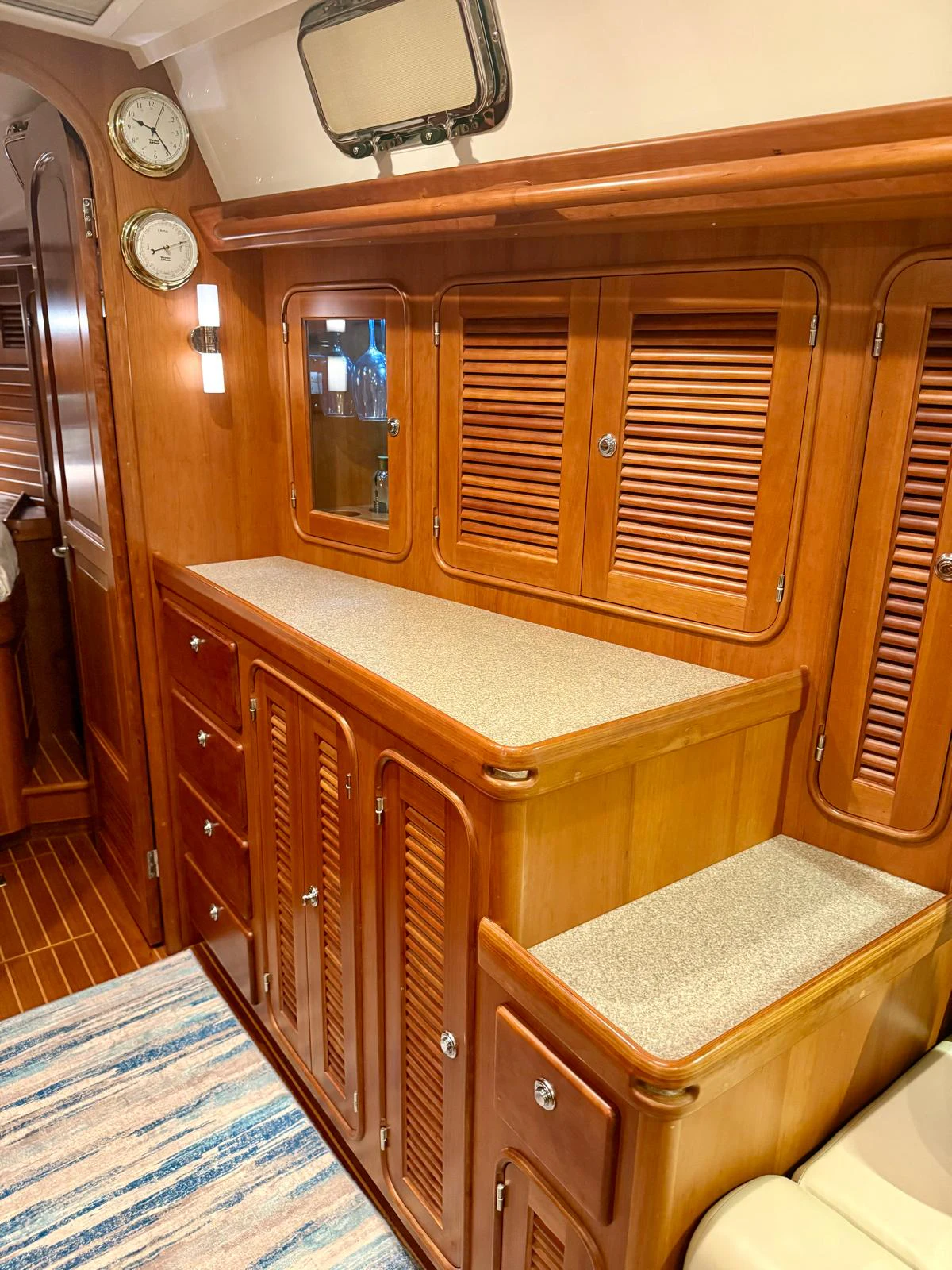 a bathroom with a mirror and cabinets aboard SAUCY FOX Yacht for Sale