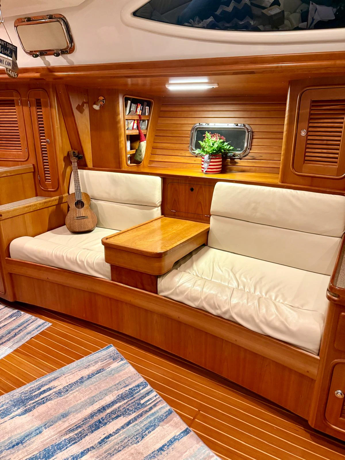 a room with a couch and a table aboard SAUCY FOX Yacht for Sale