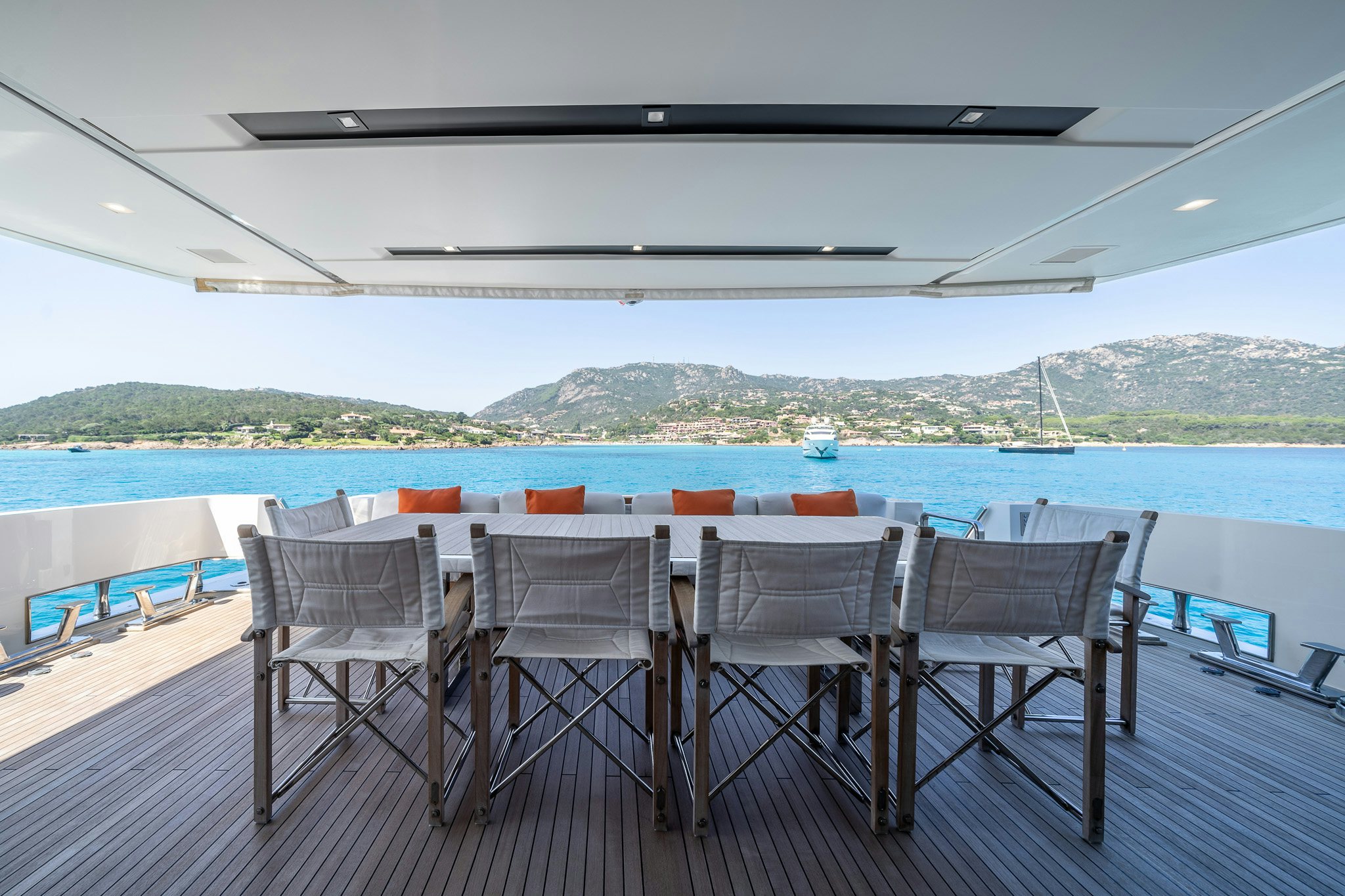 a table and chairs on a deck aboard BLUE ANGEL Yacht for Sale