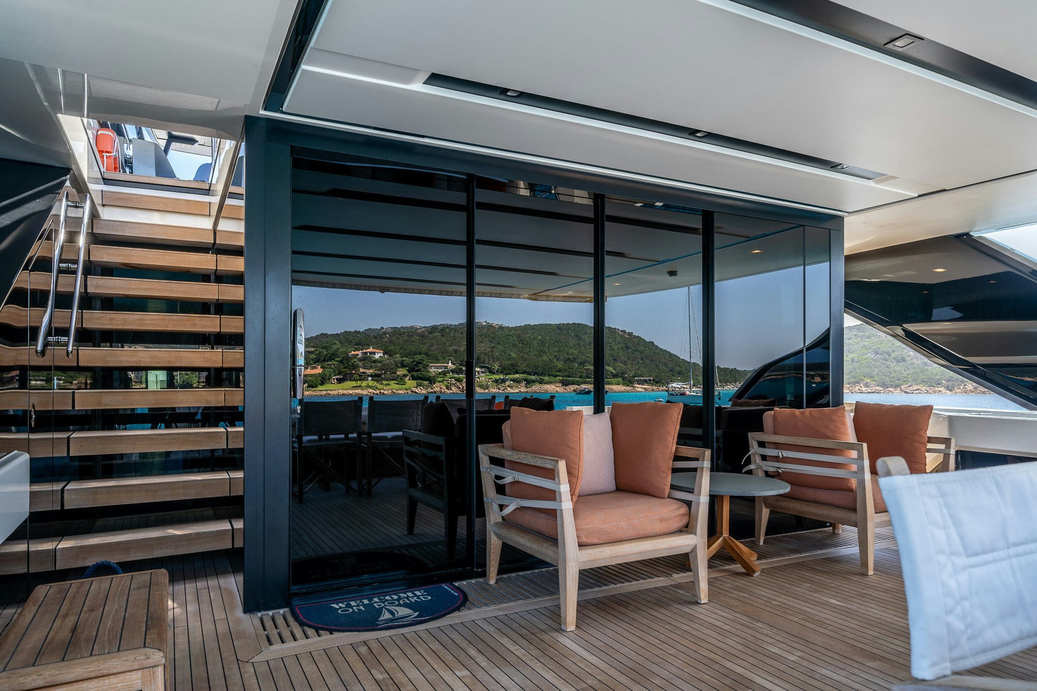 a deck with chairs and a railing aboard BLUE ANGEL Yacht for Sale