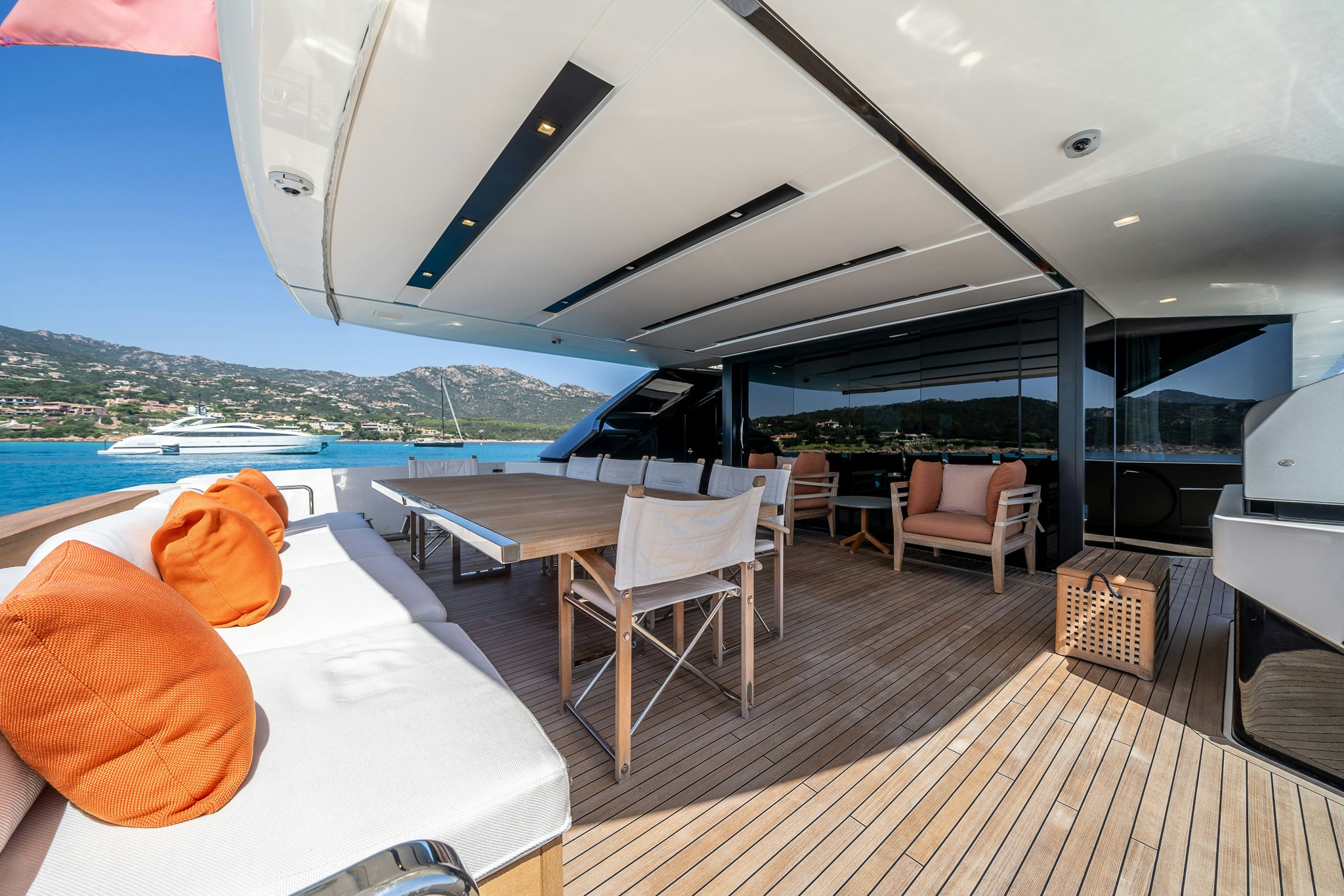 a large patio with a table and chairs on it aboard BLUE ANGEL Yacht for Sale