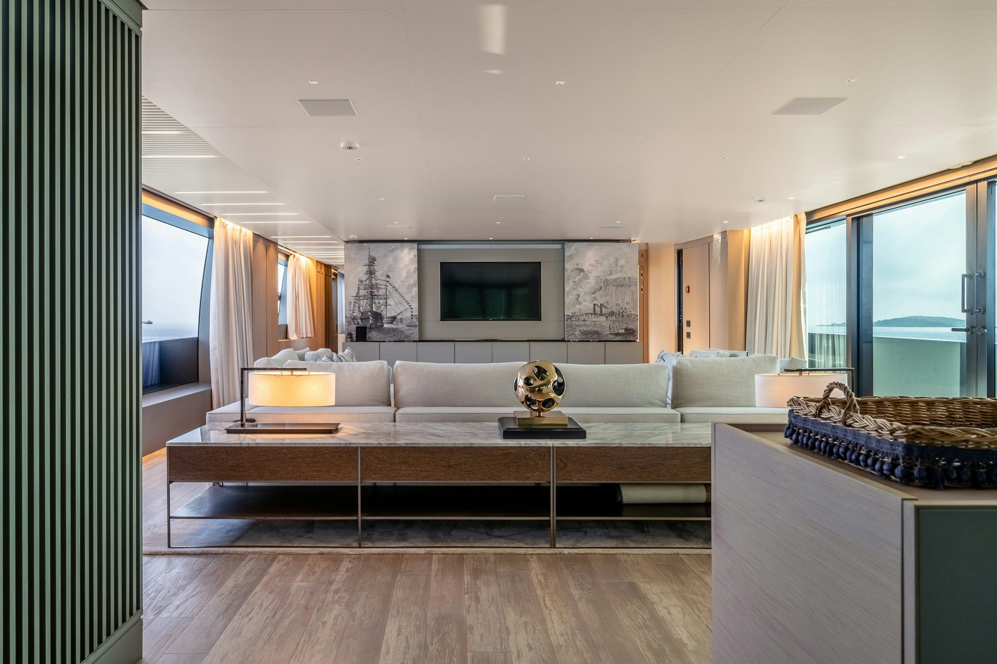 a living room with a large sofa aboard BLUE ANGEL Yacht for Sale