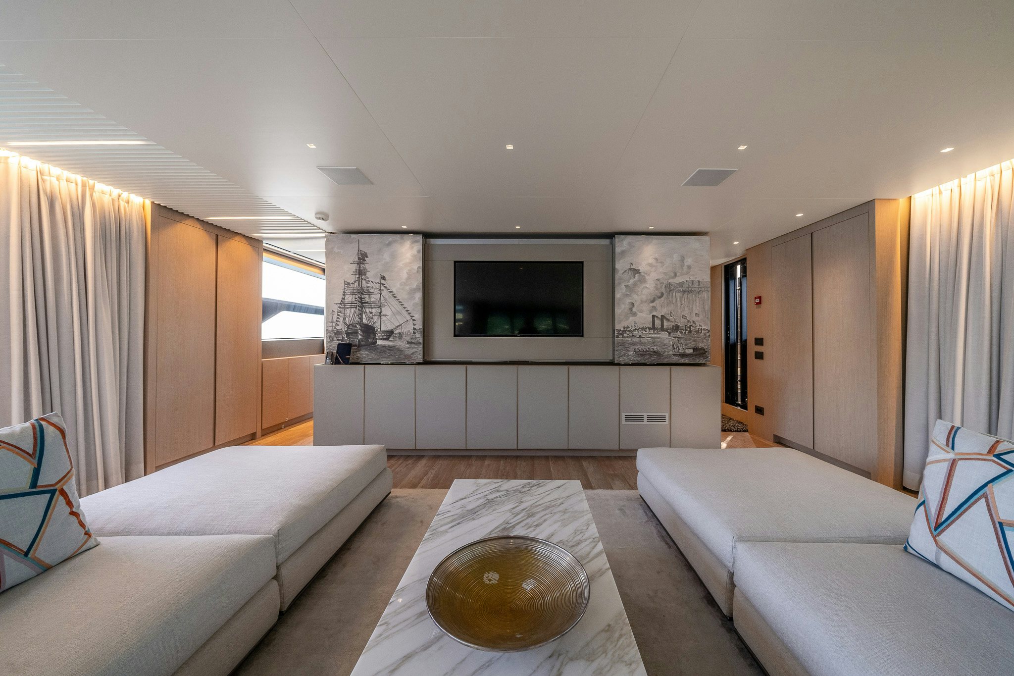 a living room with a large television aboard BLUE ANGEL Yacht for Sale
