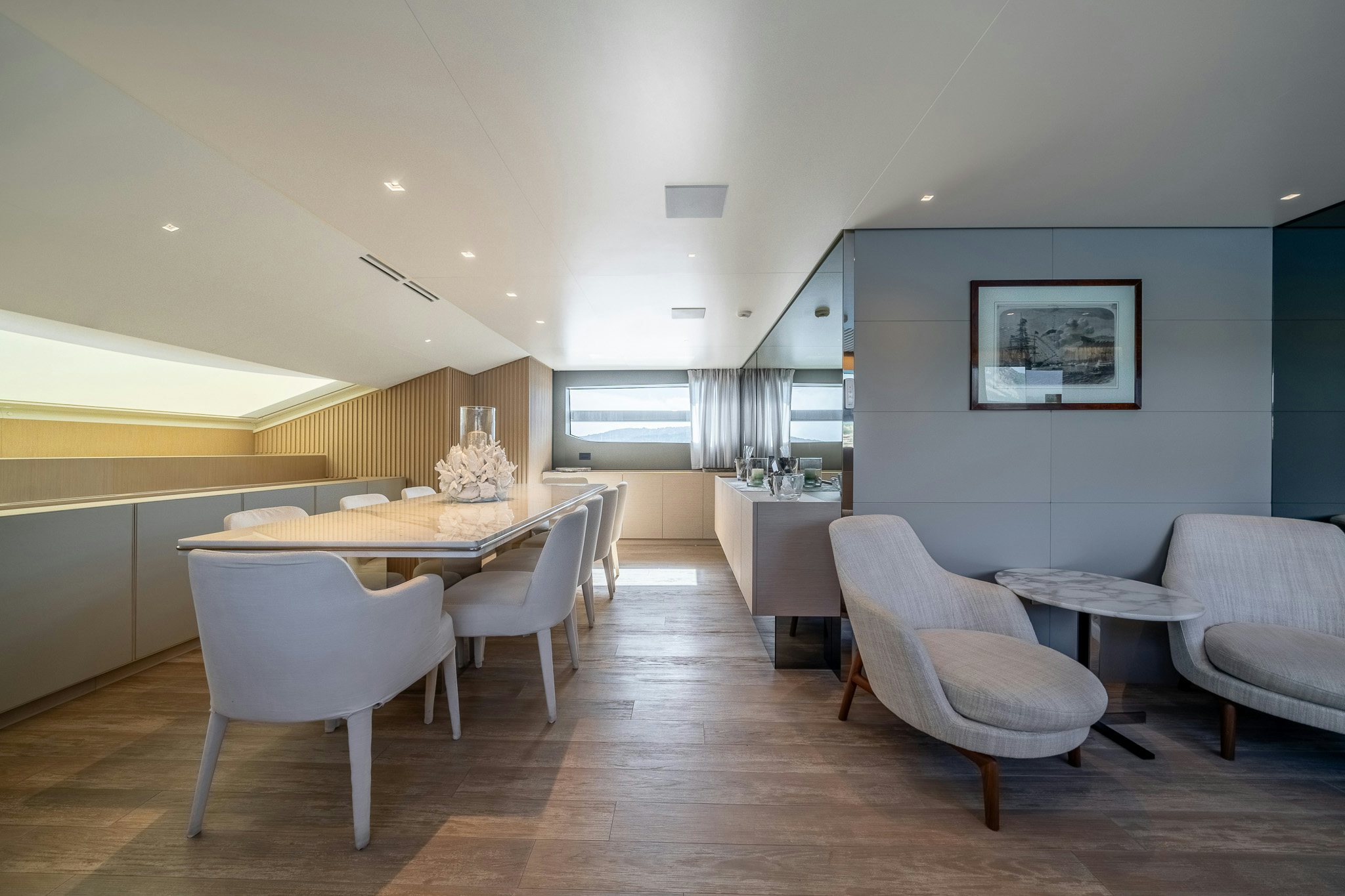 a large room with tables and chairs aboard BLUE ANGEL Yacht for Sale